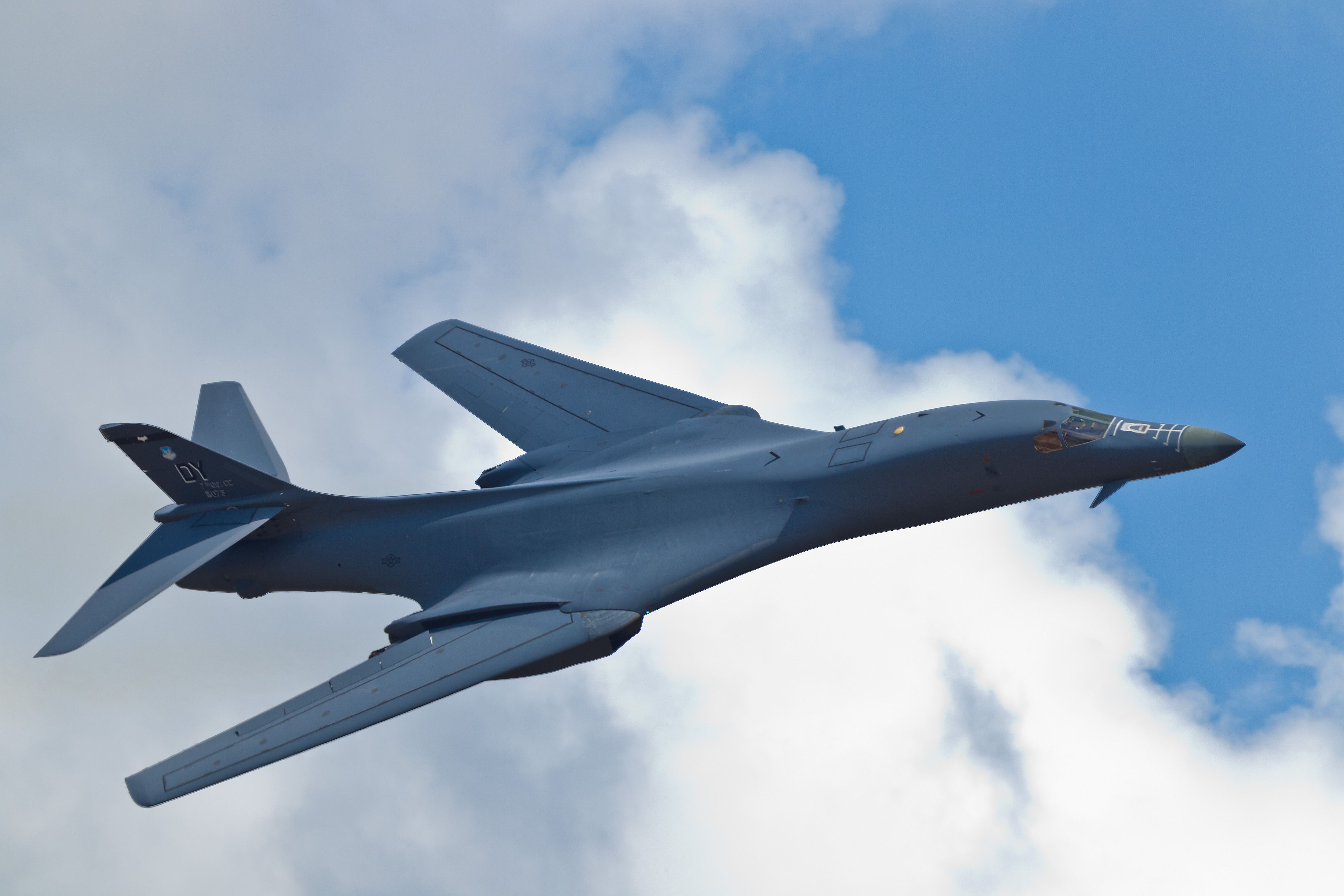 A Rockwell B-1 Lancer flying at cloud level.