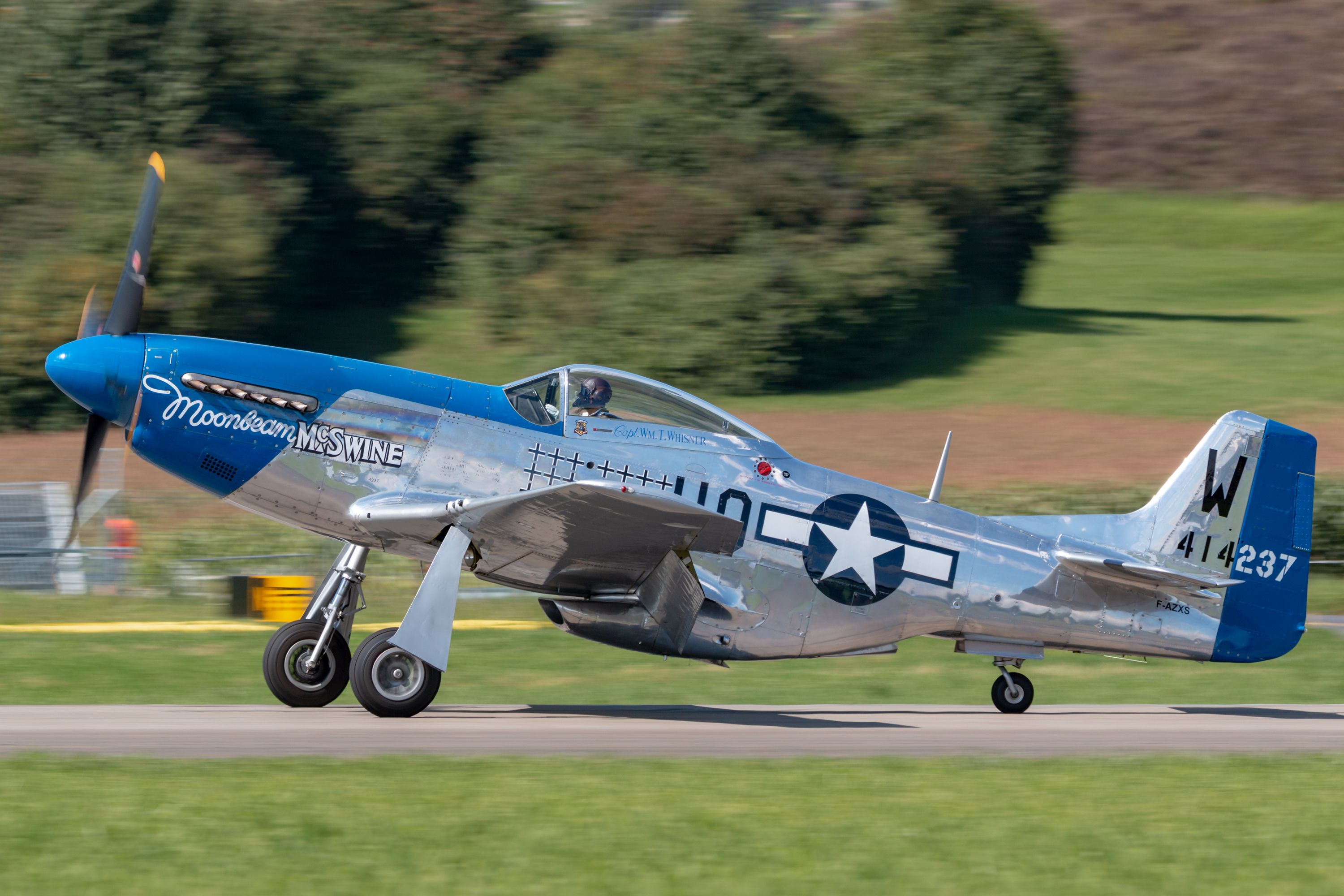 A North American P-51 Mustang on the runway.