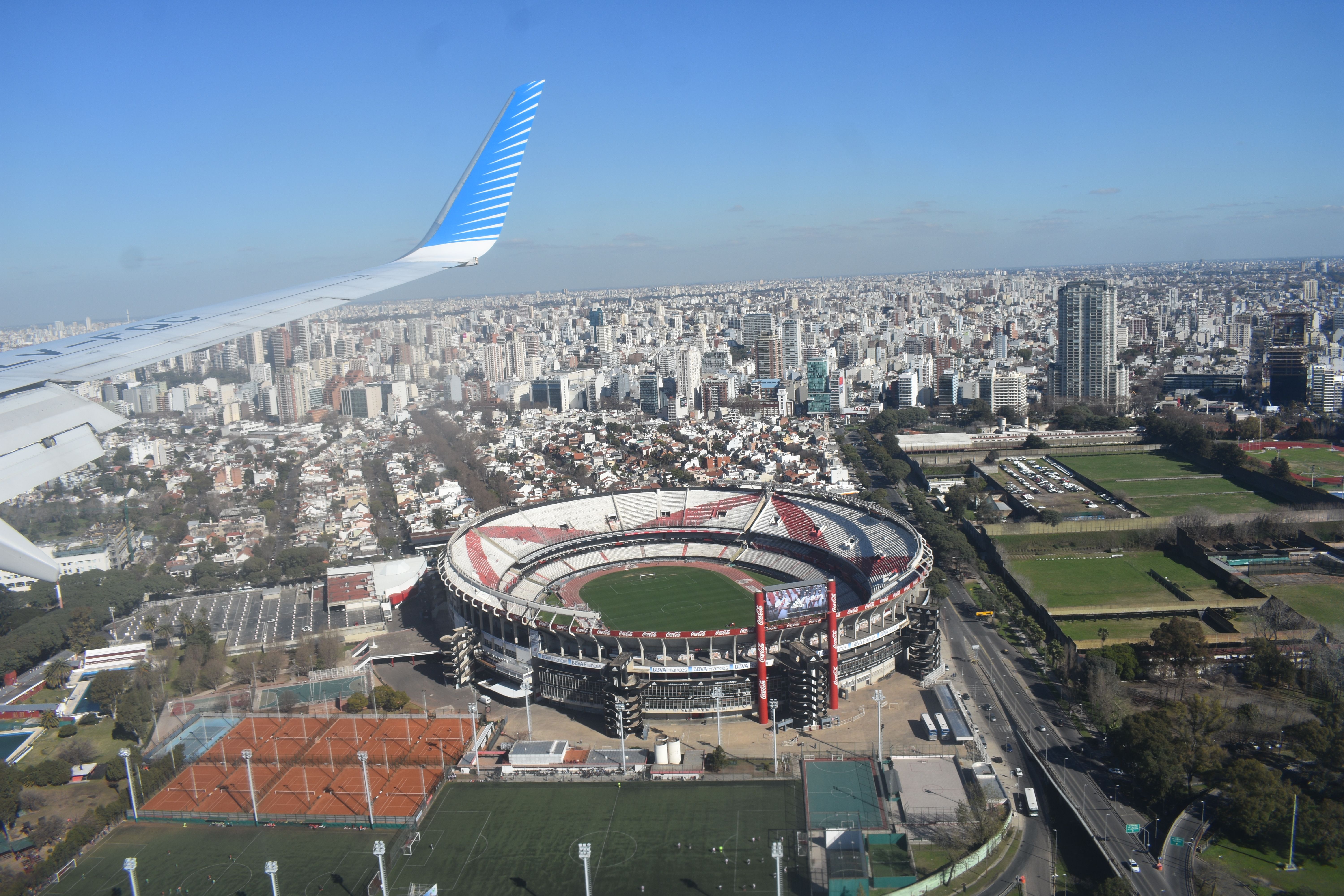 View of a football stadium from inside an airplane. 