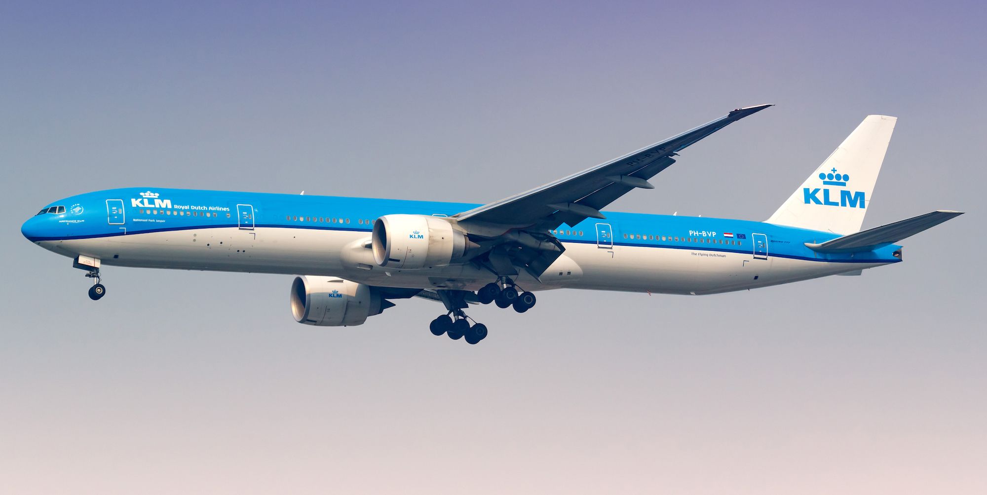A KLM 777-300ER flying in the sky.