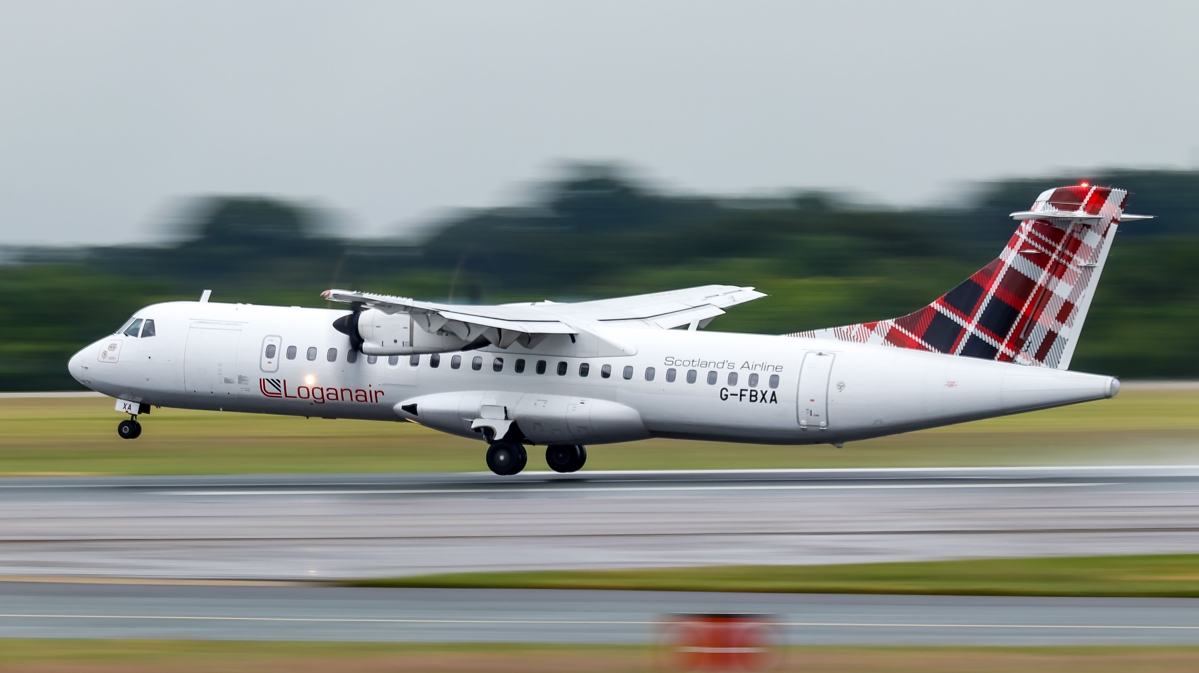 Loganair ATR 72 G-FBXA lifting off from Manchester Airport