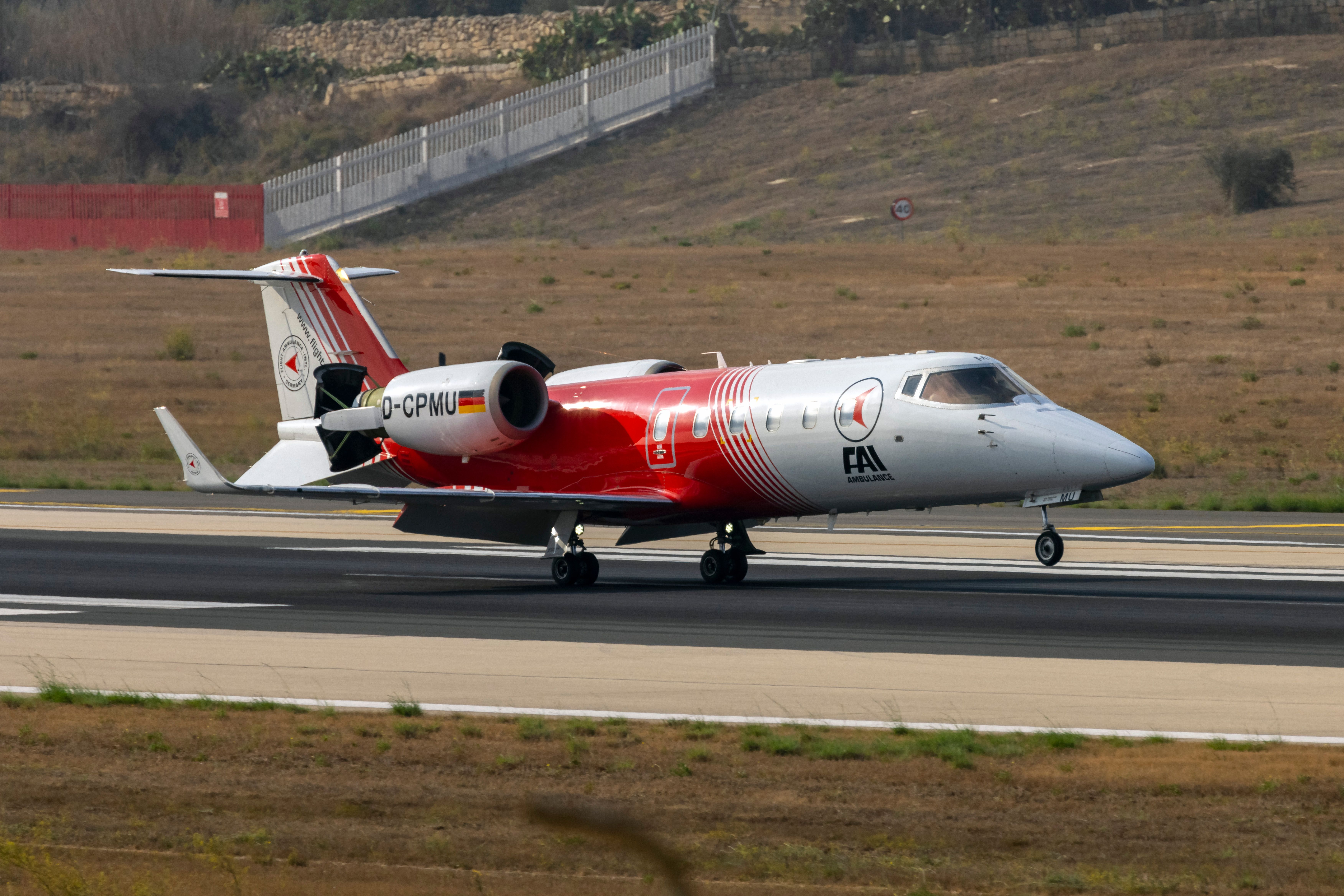 An Air Ambulance aircraft mid rotation at Malta airport.