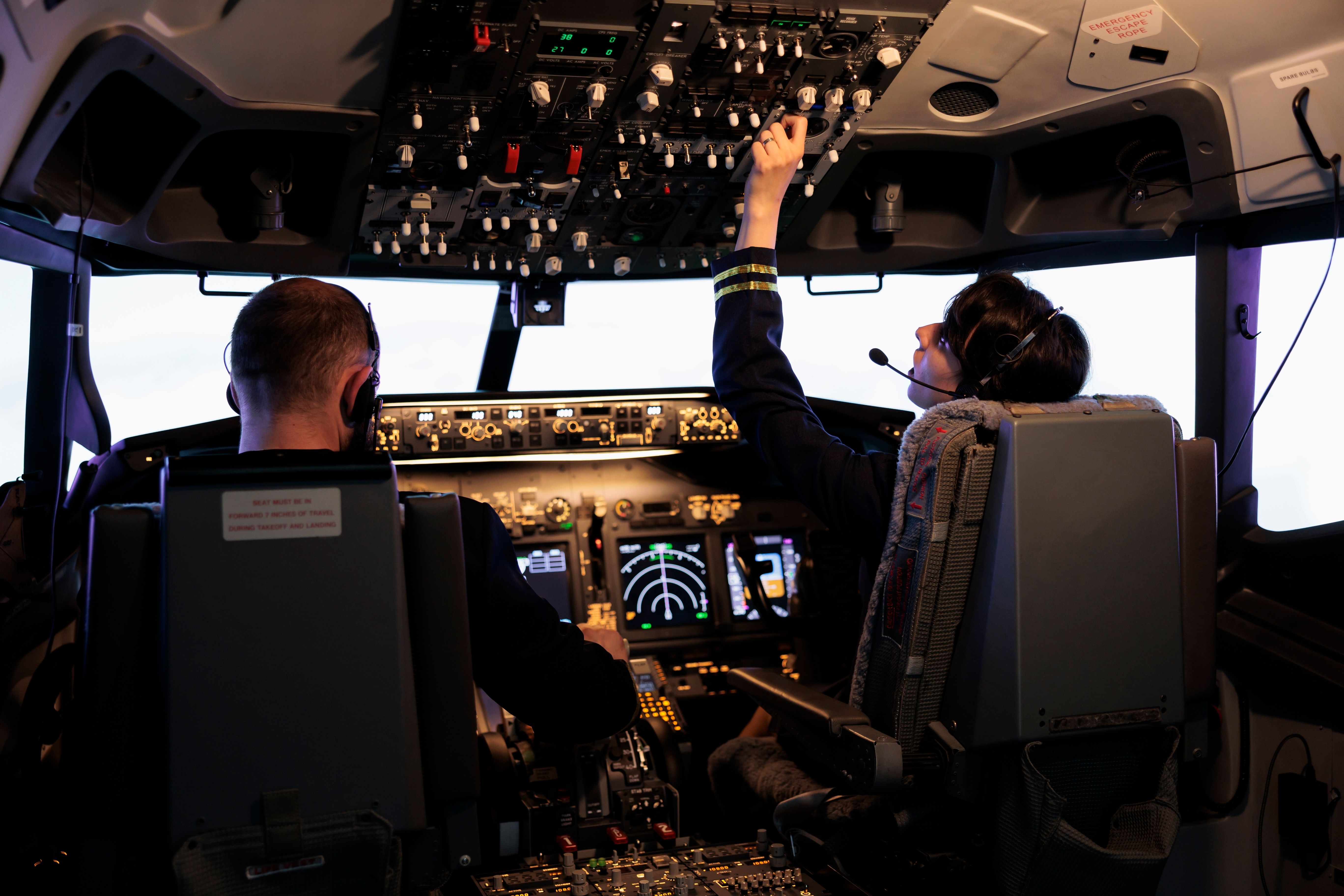 Pilots working in the cockpit.
