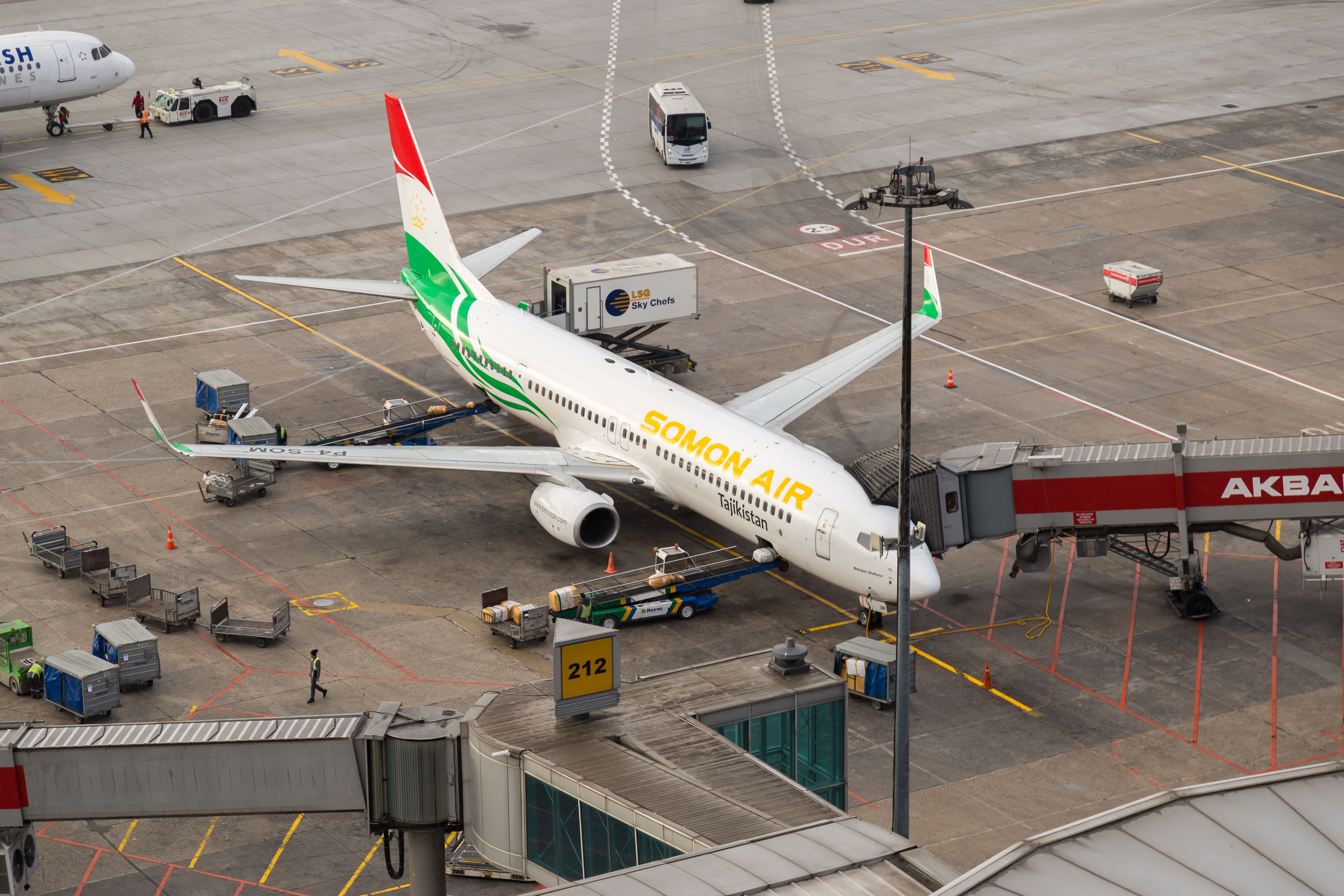 A Somon Air Boeing 737 at an airport gate.