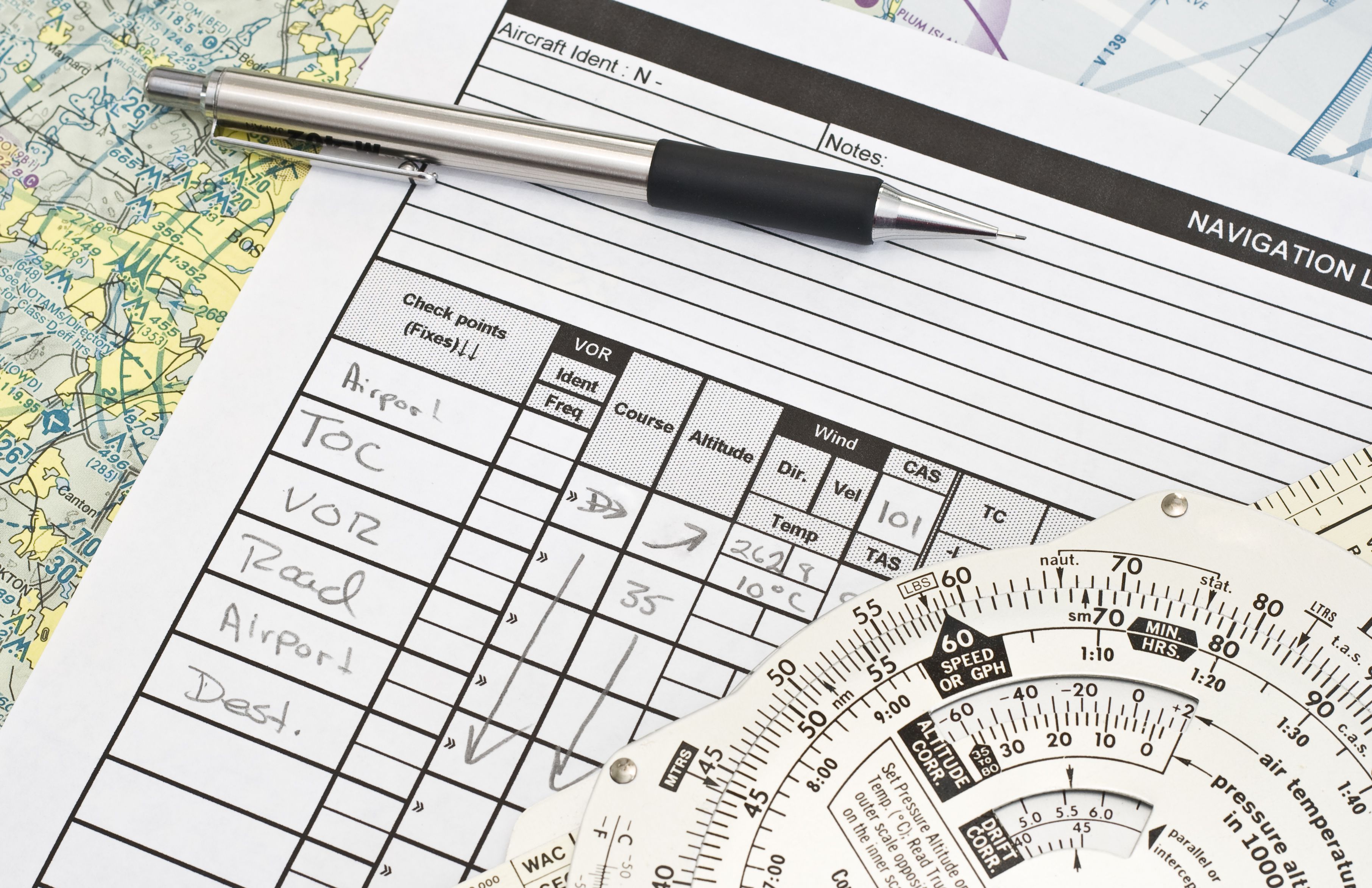 A paper navigation log made by a student pilot.