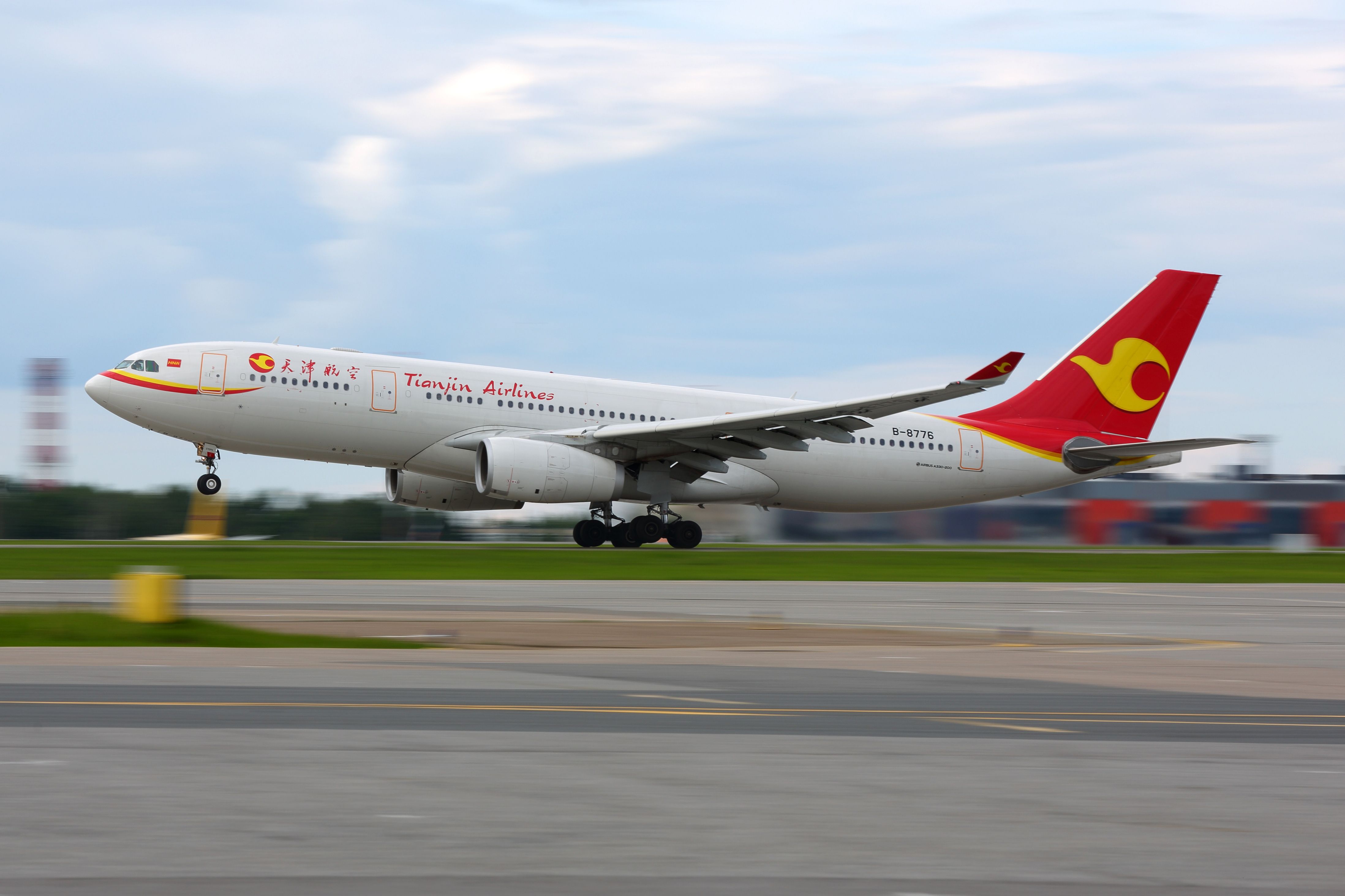 A Tianjin Airlines Airbus A330 just after takeoff.