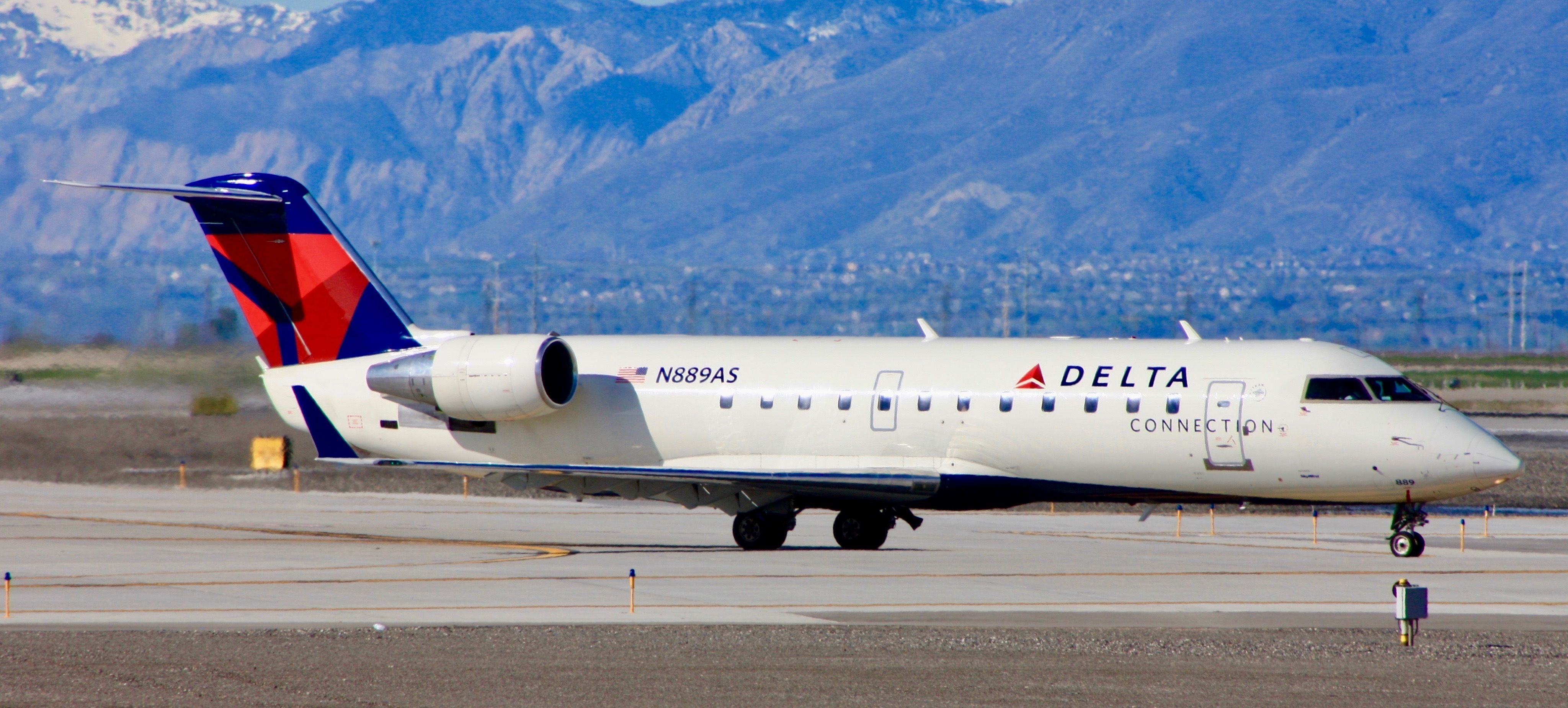 A Delta Air Lines Bombardier CRJ 200 on a taxiway.