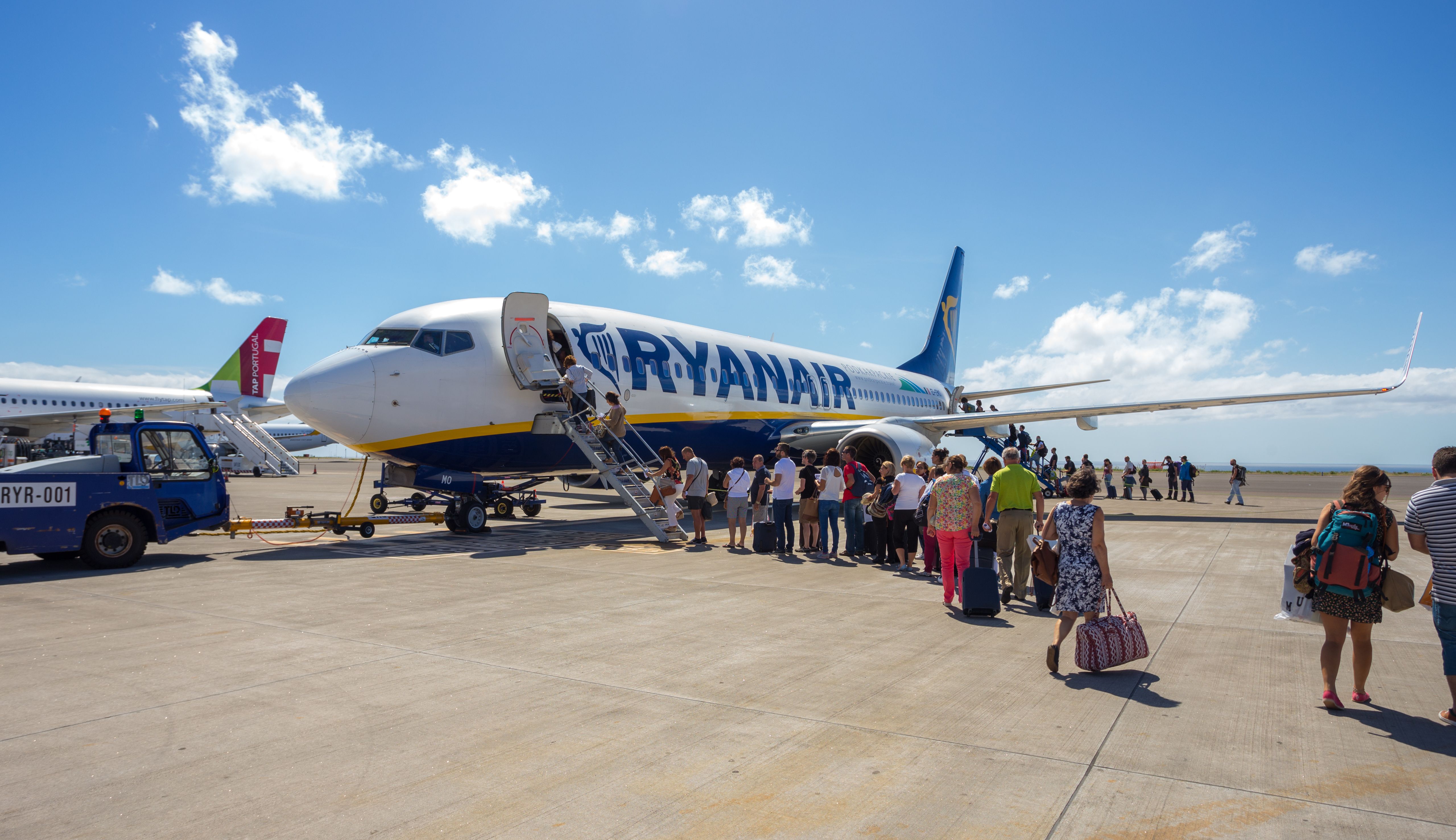 Azores, Portugal - September 20, 2016: Passengers boarding on the aircraft of low cost airline company Ryanair.
