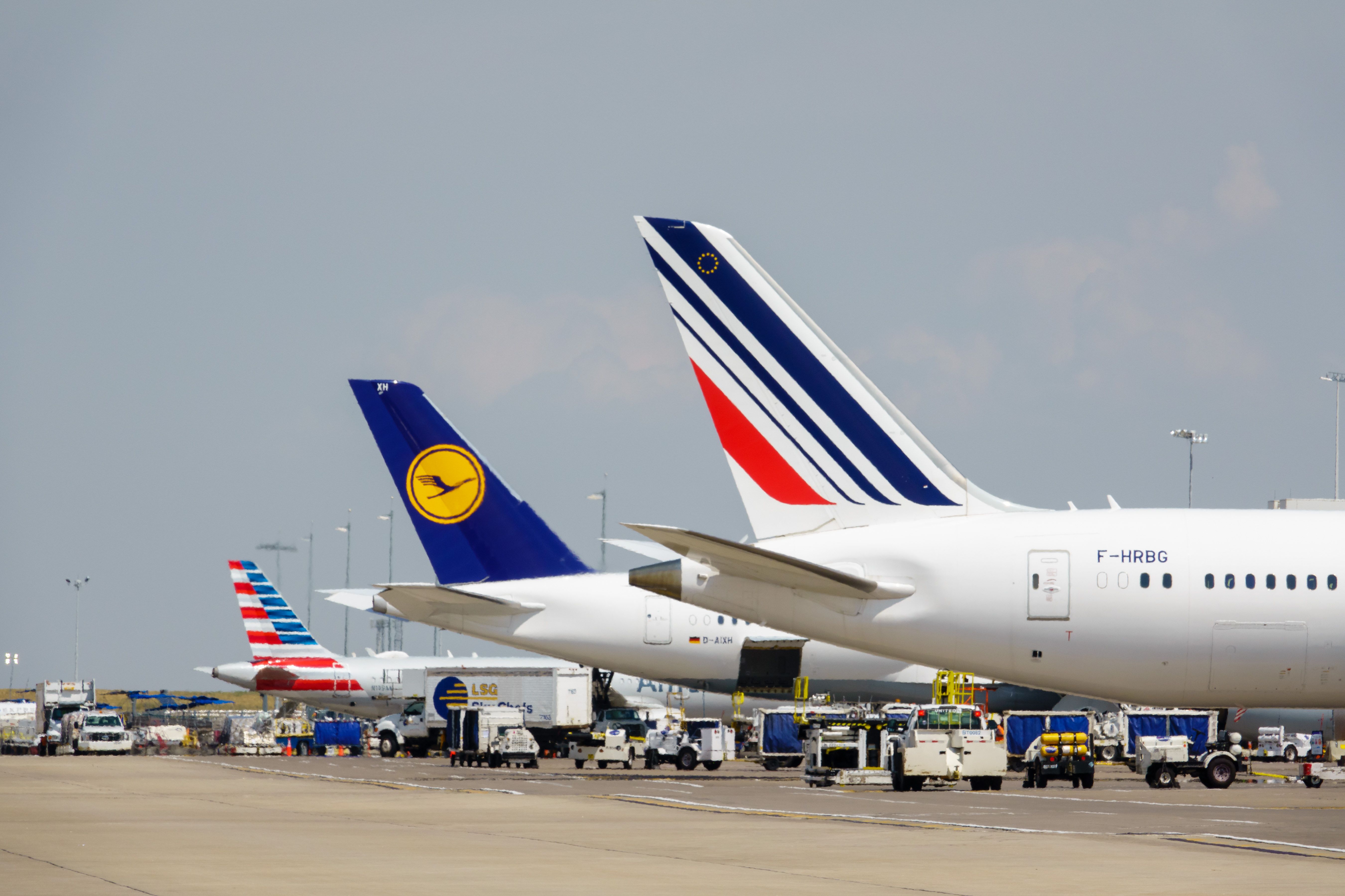 Lufthansa, American Airlines and Air France aircraft parked at Denver International Airport.