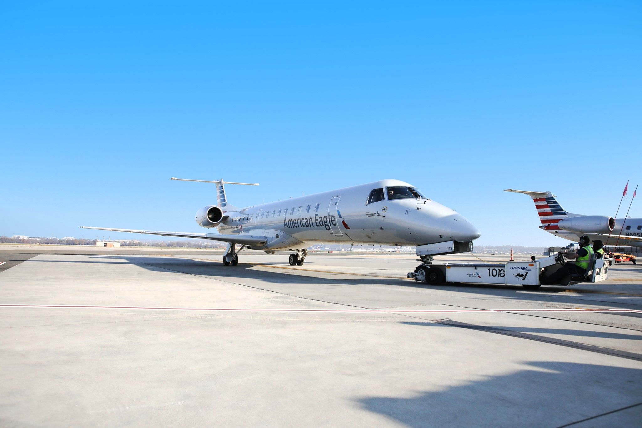 Piedmont Airlines Embraer ERJ-145 being pushed back.