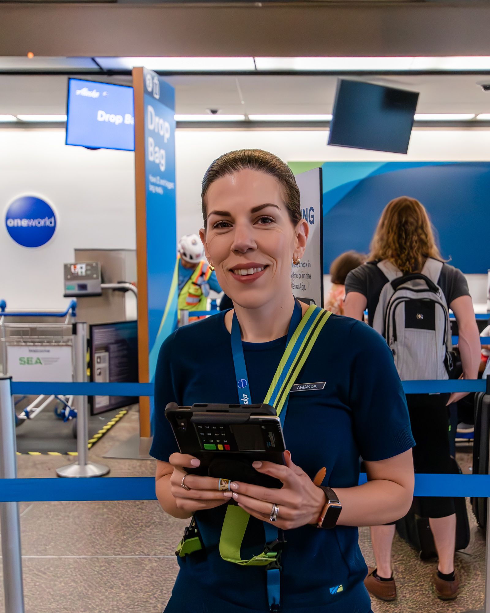 Amanda, An Alaska Airlines Customer Service Agent at SEA, With Her Tablet