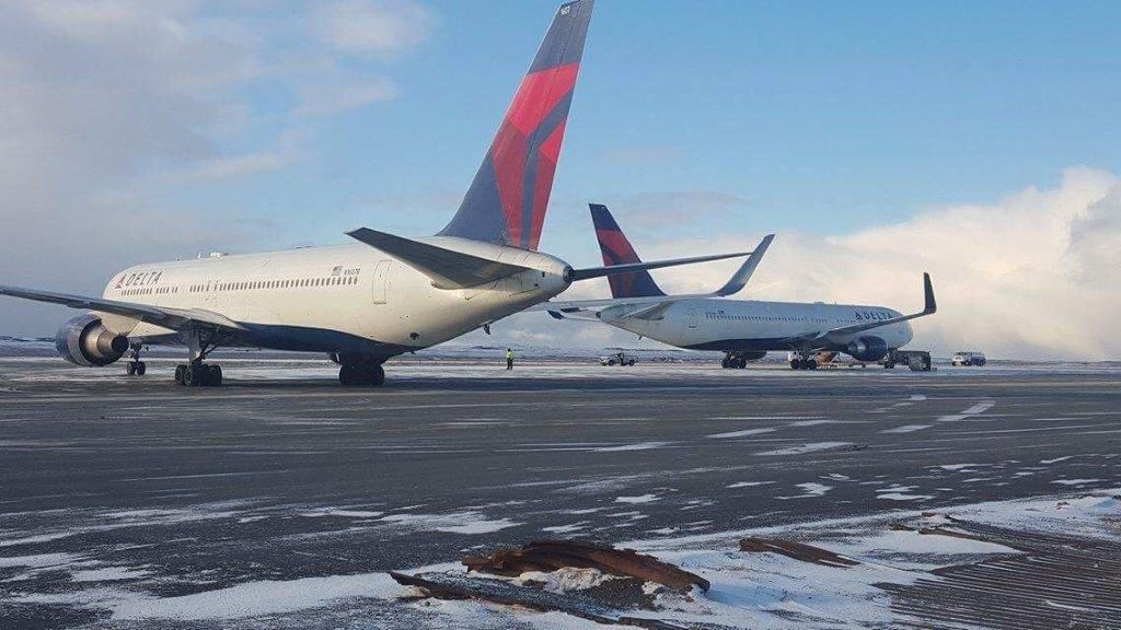 Delta 767 aircraft parked in winter