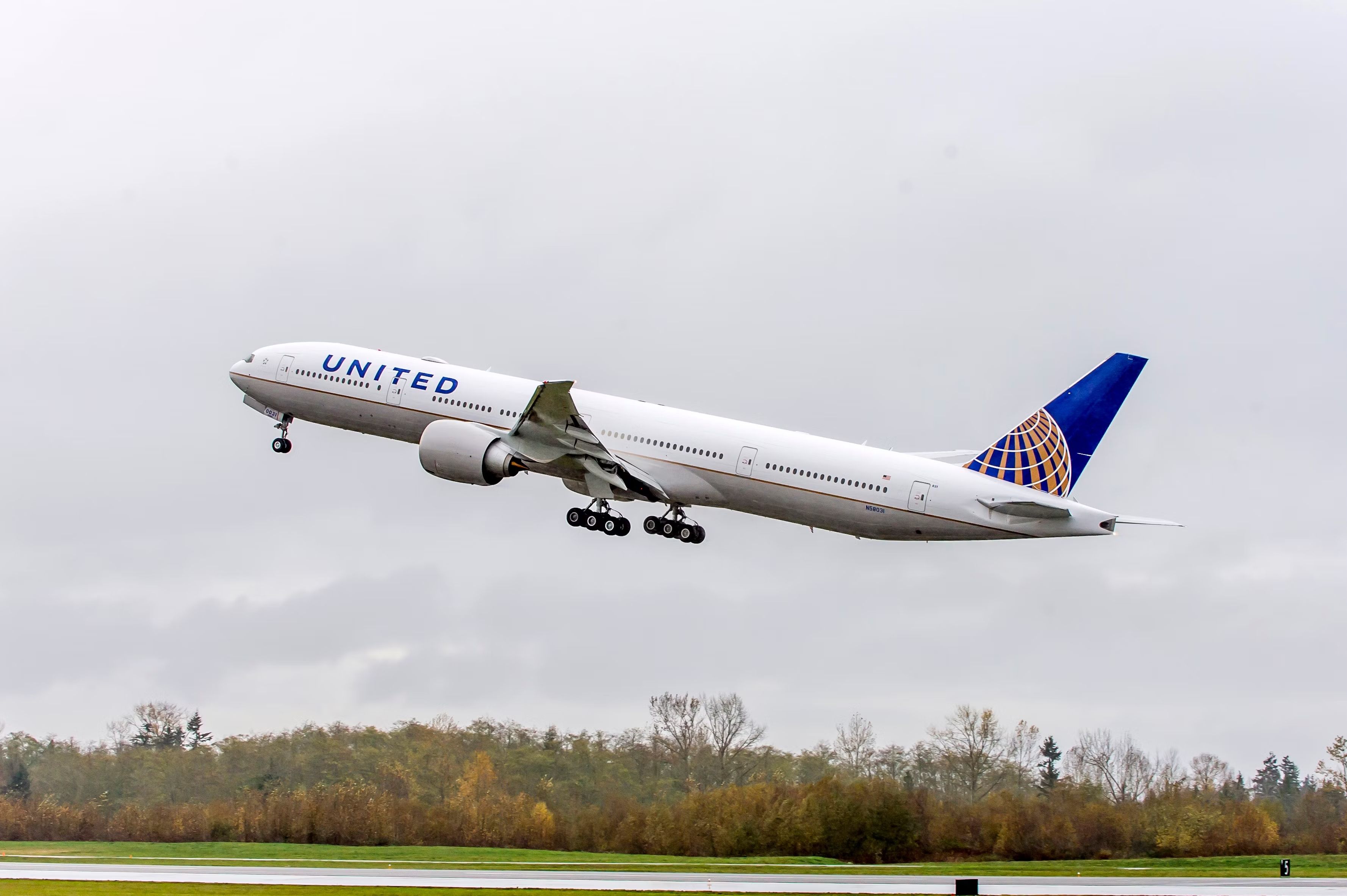 A United Airlines 777-300ER just after takeoff.