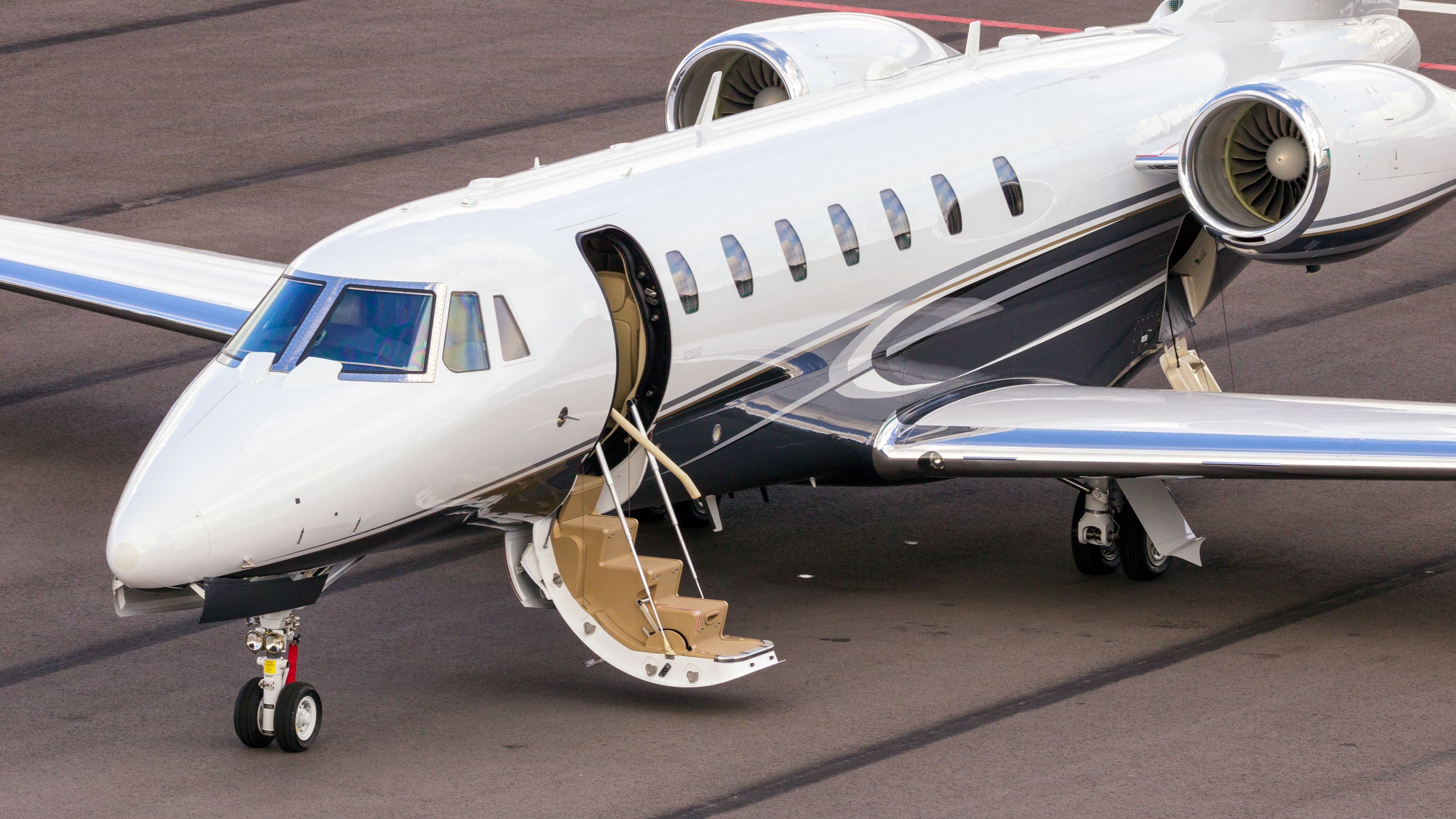 A Cessna 680 Citation Sovereign business jet parked at an airport.