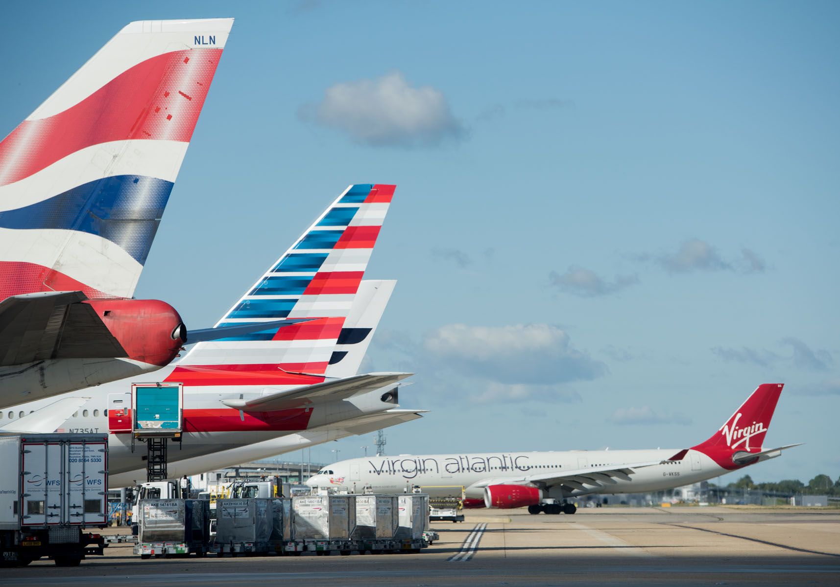 British Airways, American Airlines, and Virgin Atlantic aircraft at London Heathrow Airport.