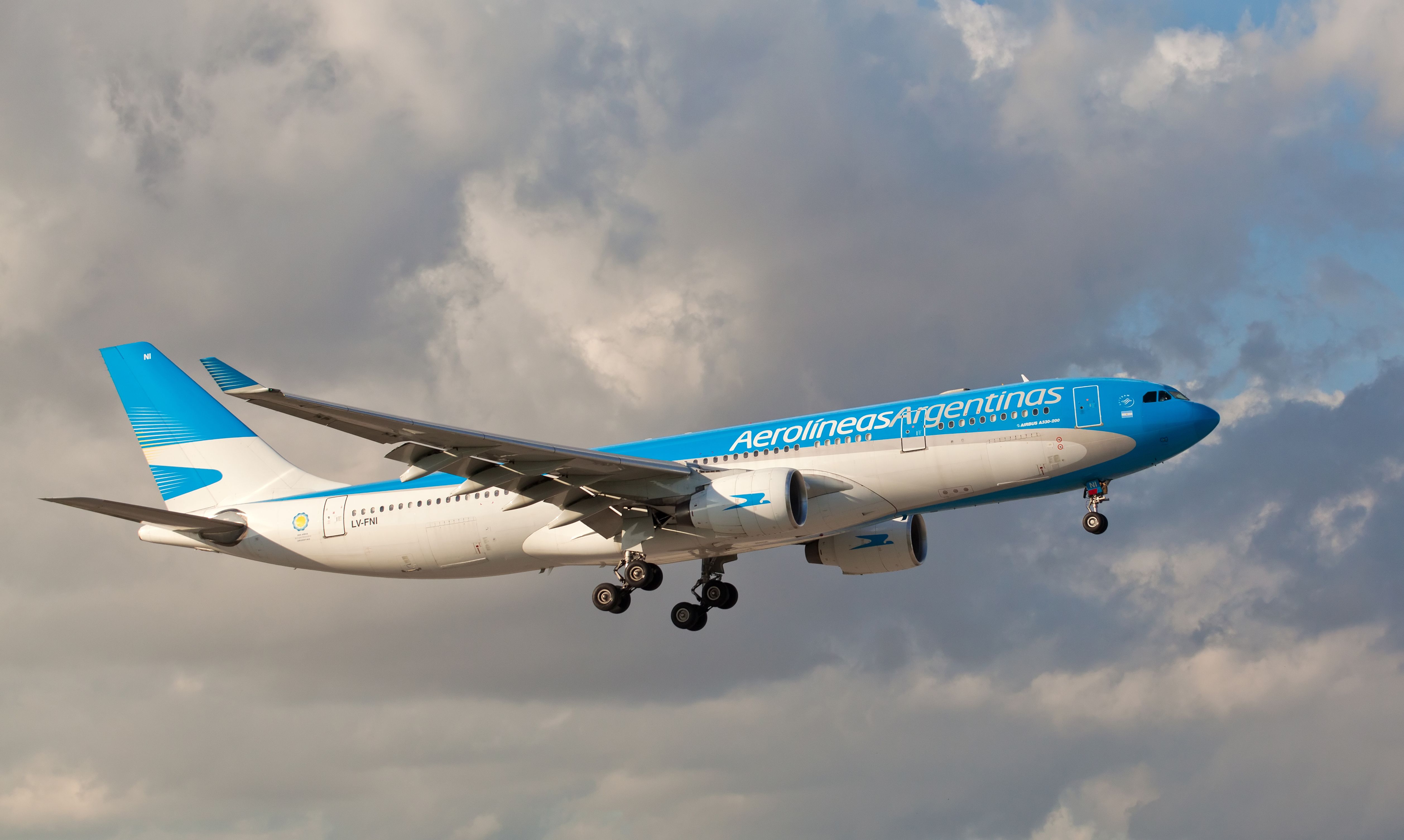 An Aerolineas Argentinas Airbus-330 flying in the sky.