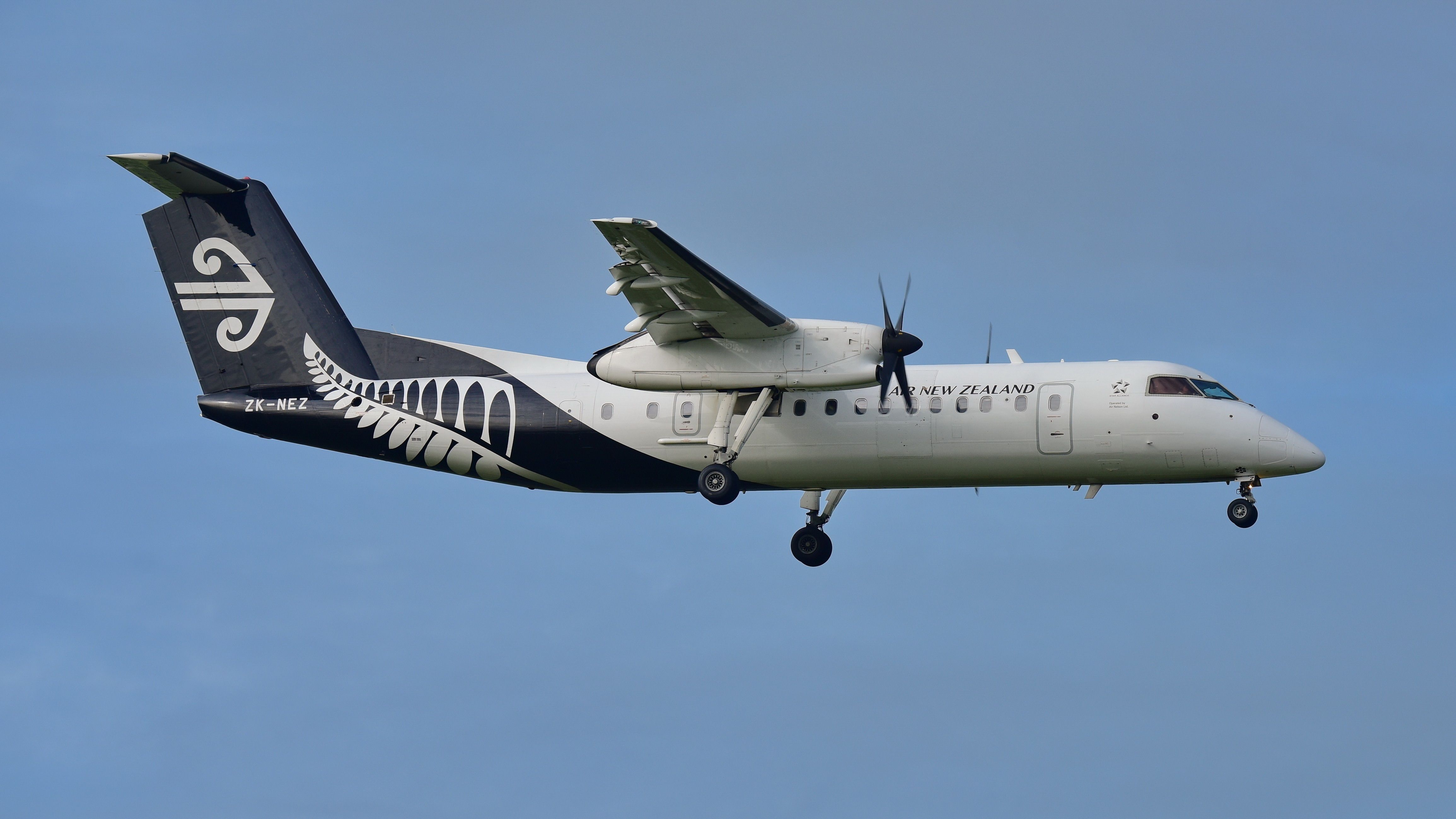 An Air New Zealand Dash 8 Q300 flying in the sky.