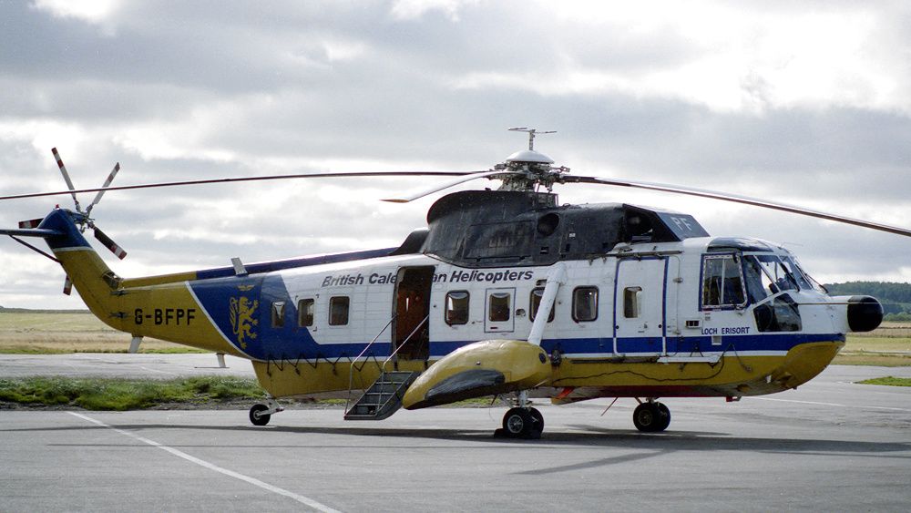 A British Caledonian Helicopters Sikorsky S61N parked at an airfield.