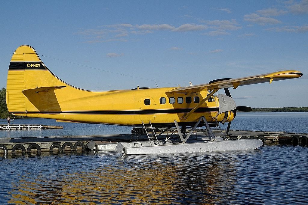 A De Havilland Canada DHC-3 Otter parked in water.