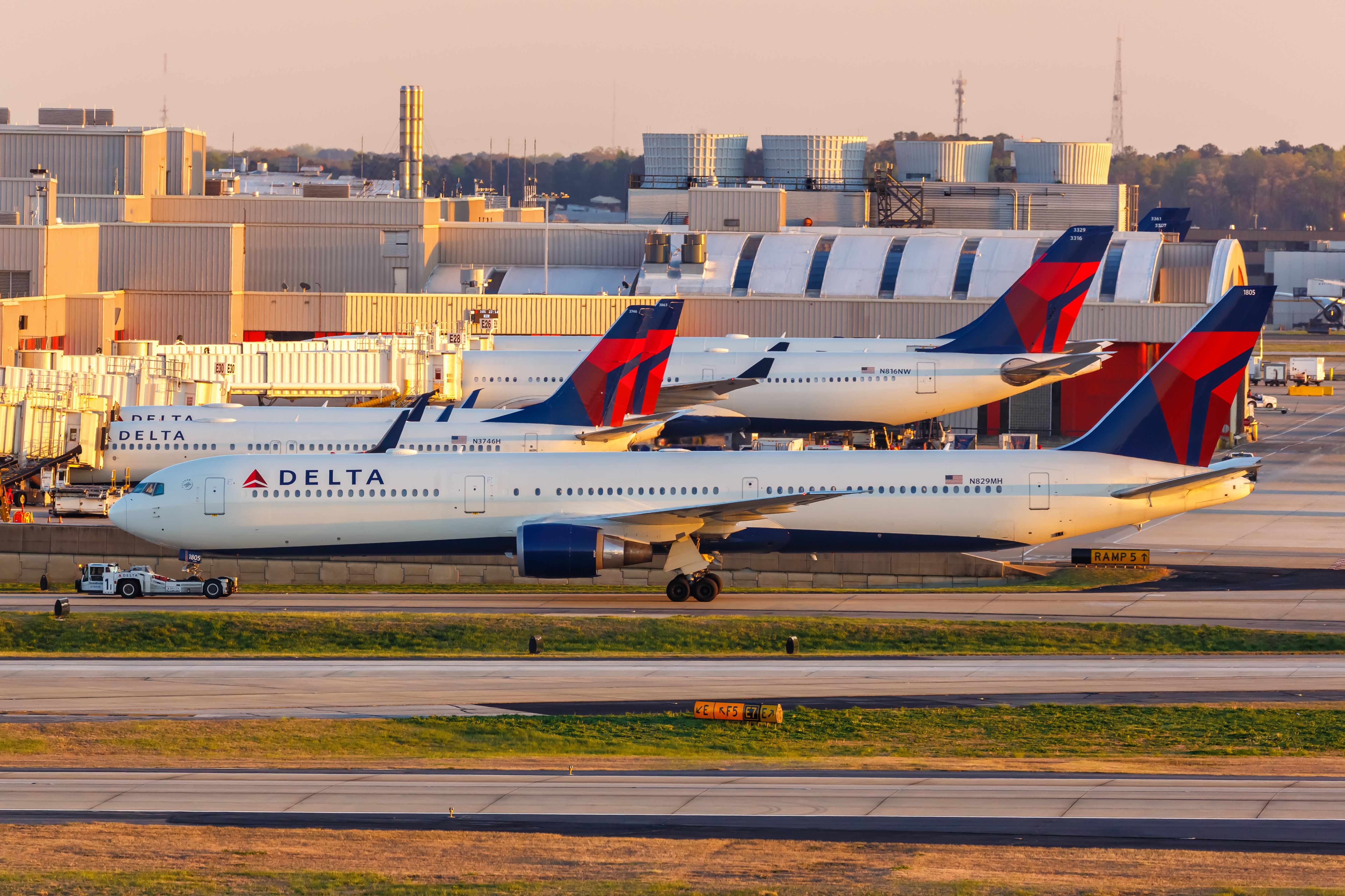 Multiple Delta Air Lines aircraft at Hartsfield-Jackson International Airport.