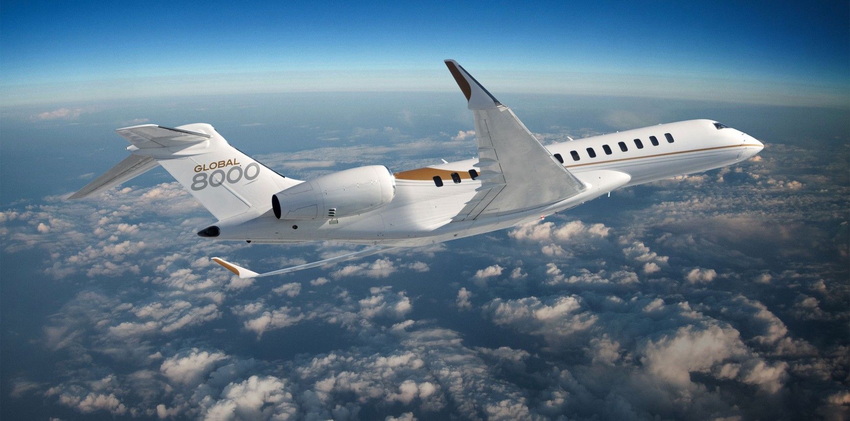 A Bombardier Global 8000 Banking Above Clouds.