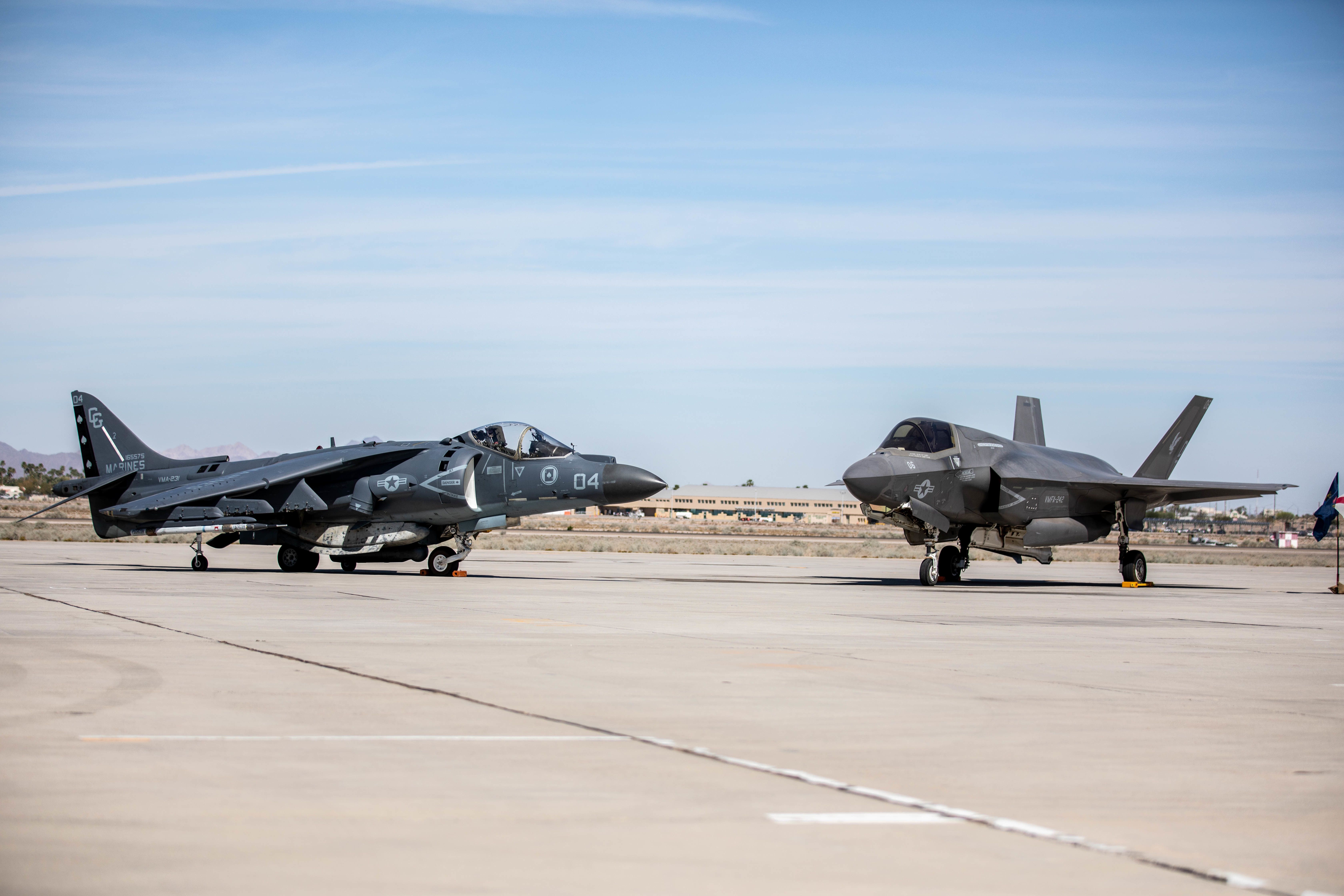 A Harrier parked next to an F-35.