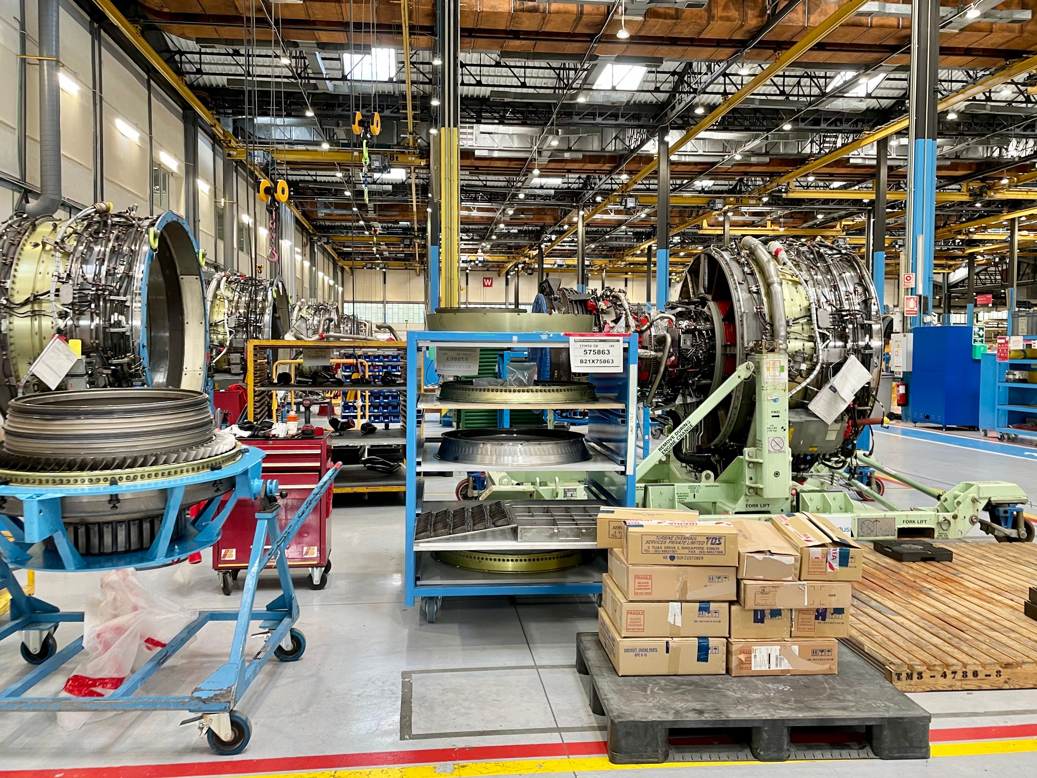 Several Engines sitting Inside the Iberia Maintenance facility.