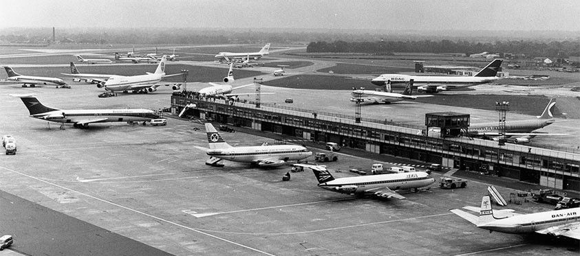 A historical black and white photo of Manchester Airport.