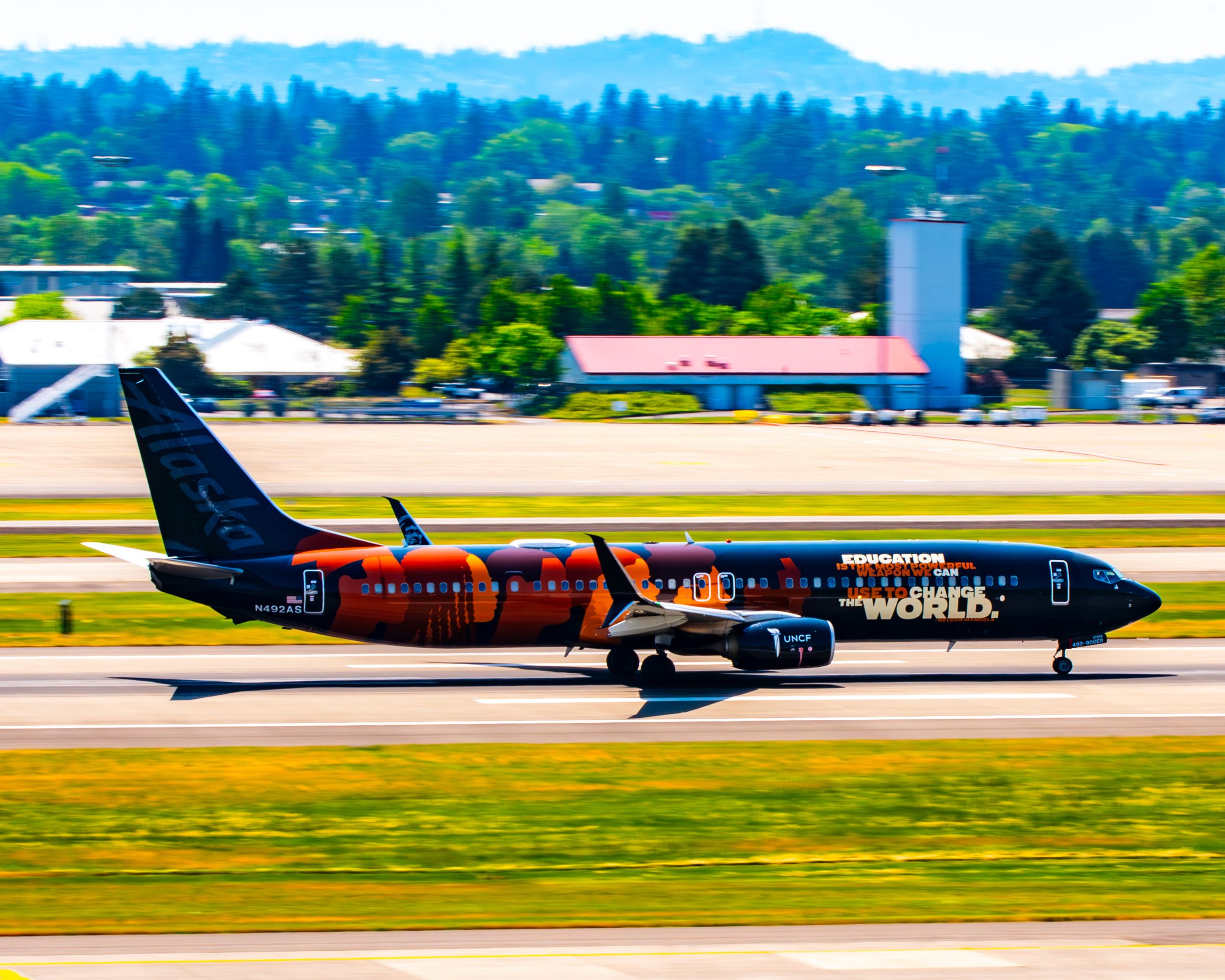 Panning the Alaska Airines -Our Coimmitment- 737-900ER Racing Down PDX Rwy - Bright and Bold