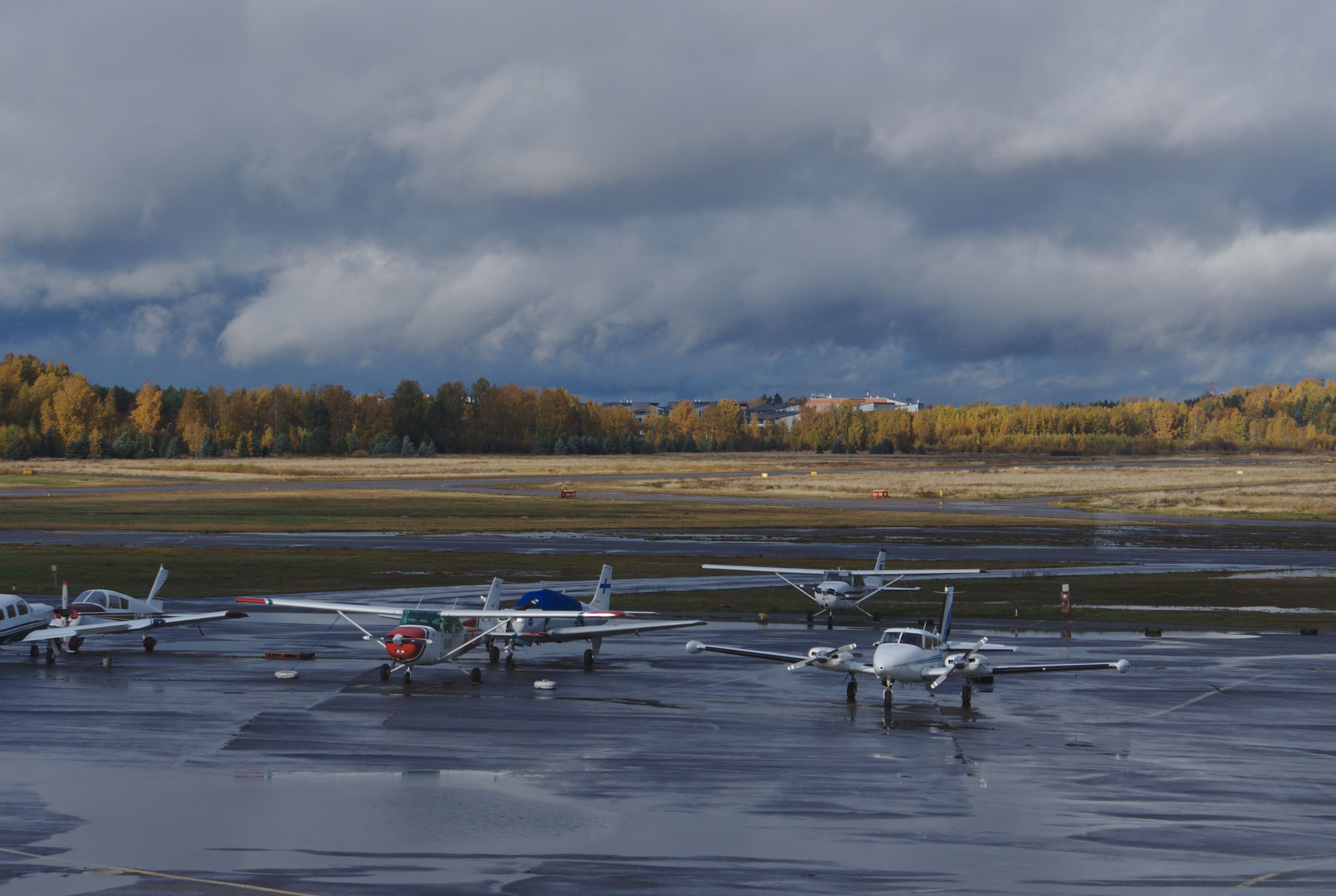 Many planes parked at Helsinki-Malmi Airport.