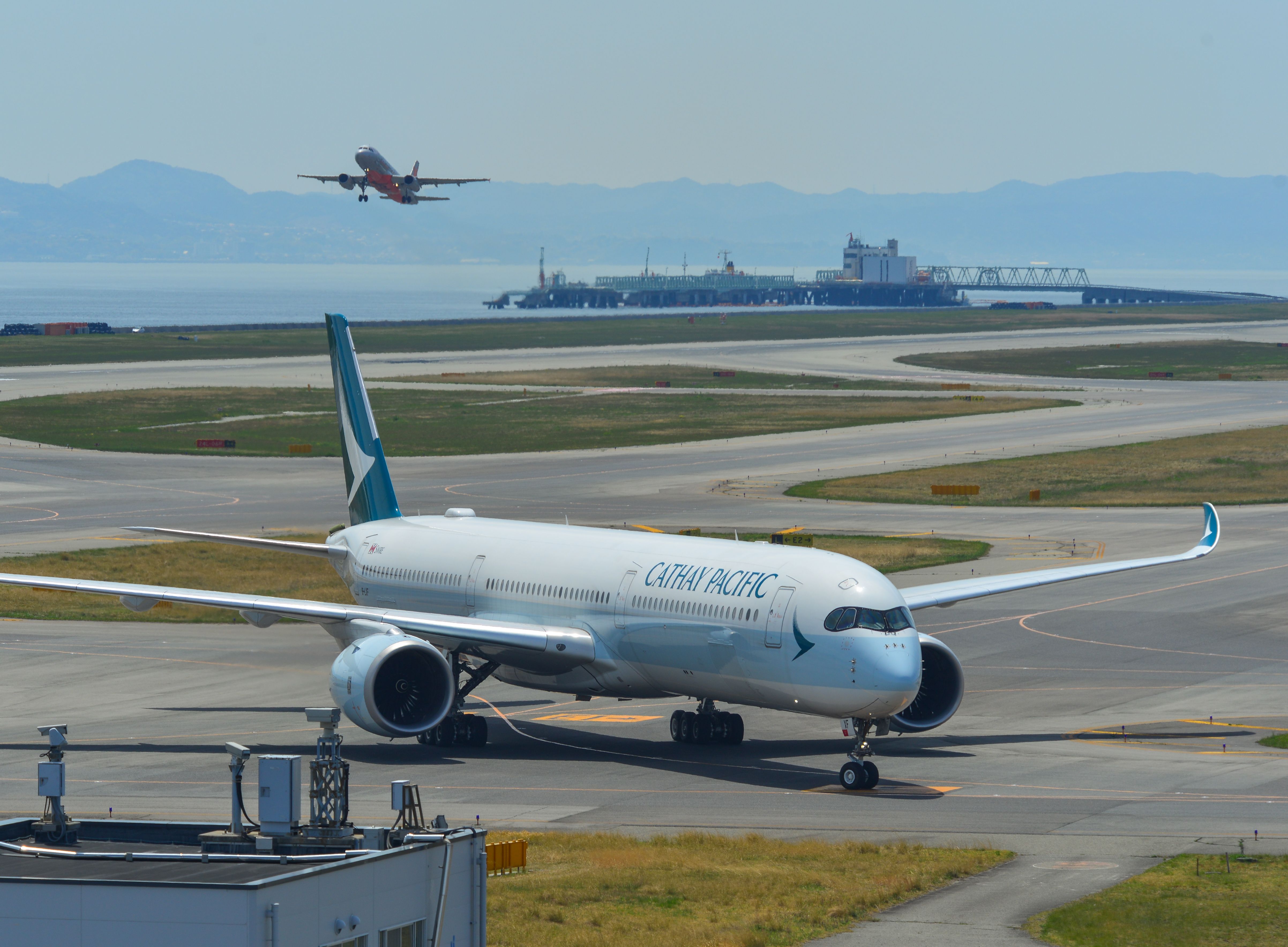 A Cathay Pacific Airbus A350 on the apron at Kansai International Airport.