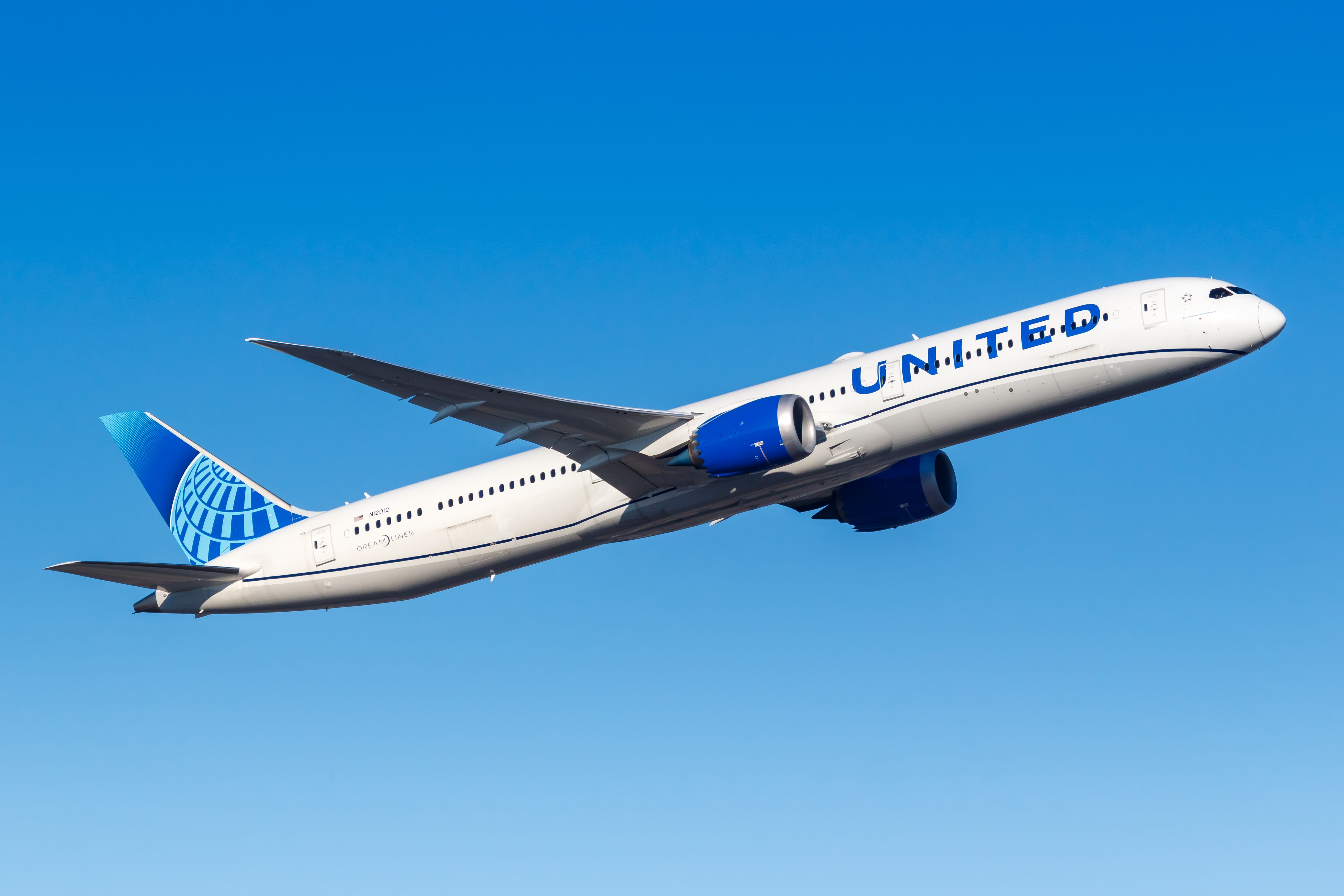 A United Airlines Boeing 787-10 flying in the sky.