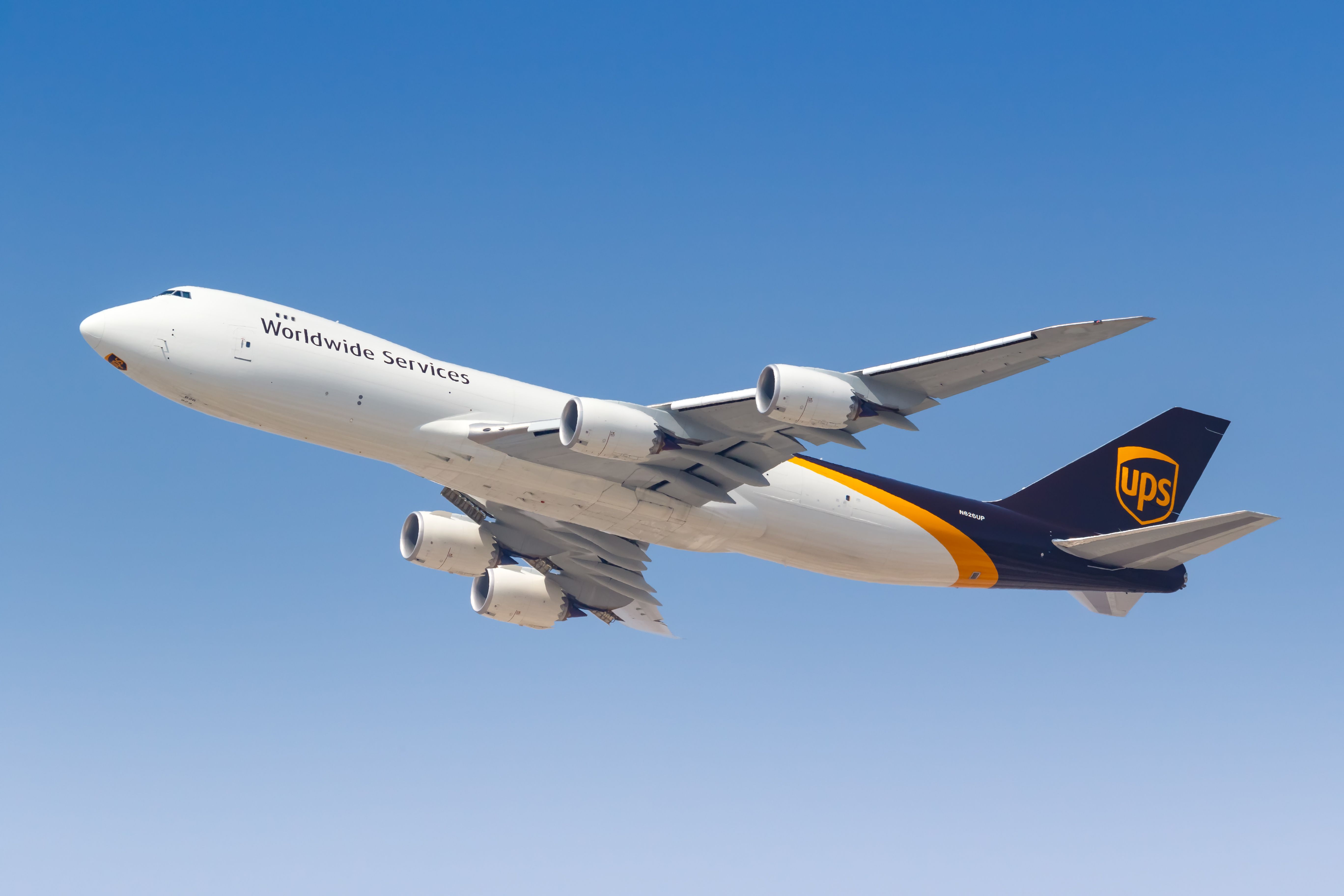 A UPS Boeing 747-8F aircraft flying in the sky.