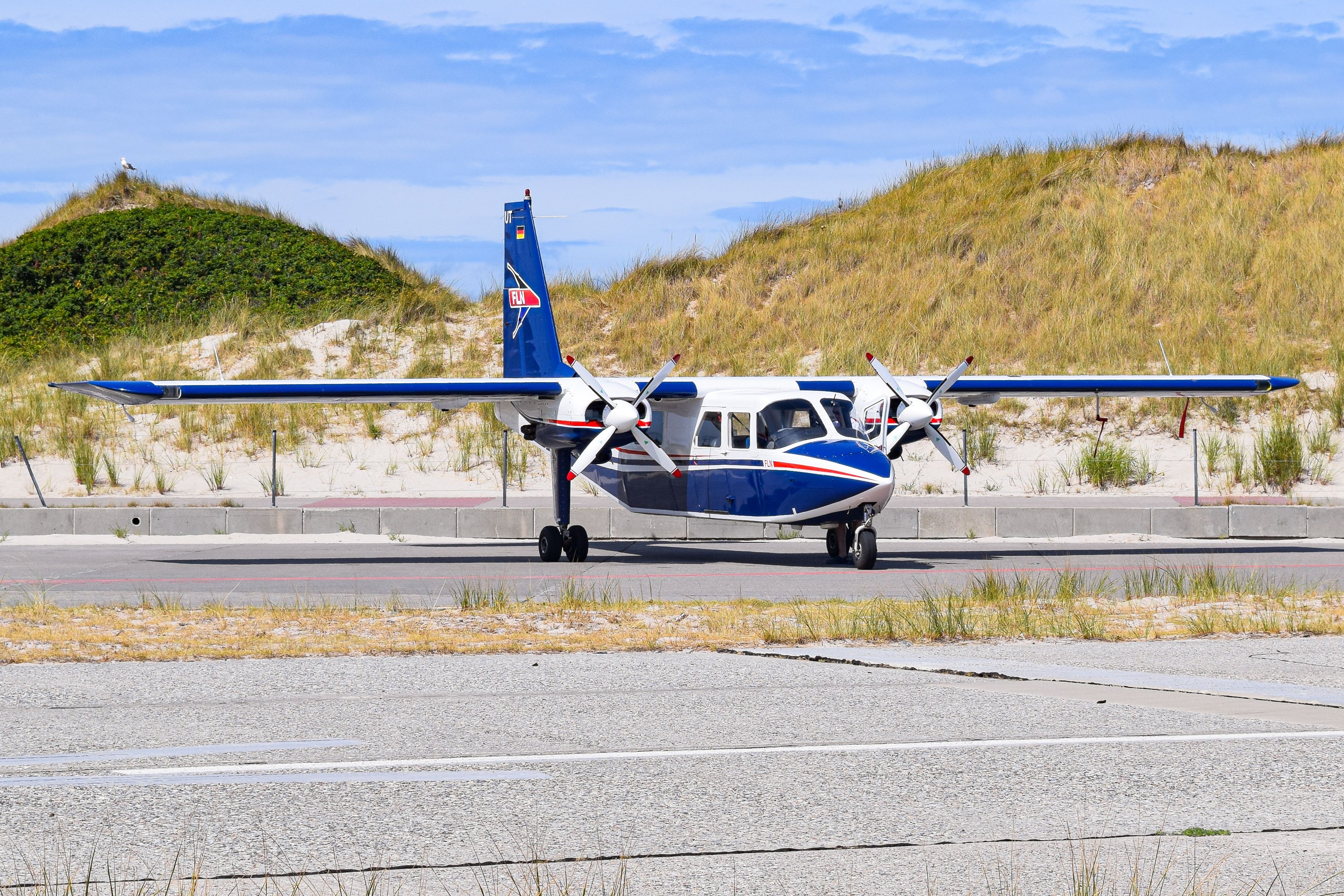 Britten Norman Islander Parked Among The Dunes In Heligoland, Germany