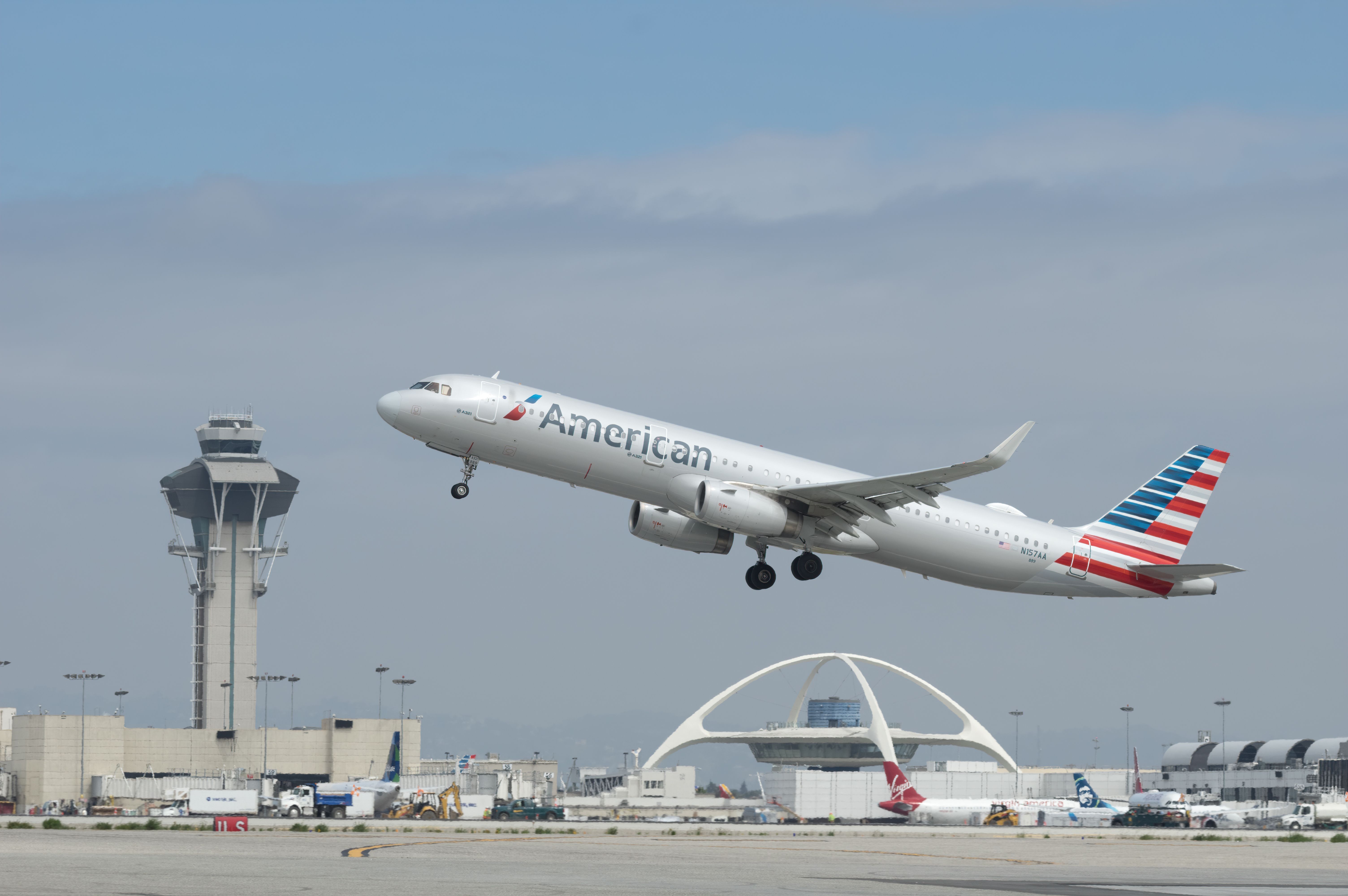 An American Airlines Airbus A321 with registration N157AA shown taking off from the Los Angeles International Airport, LAX.