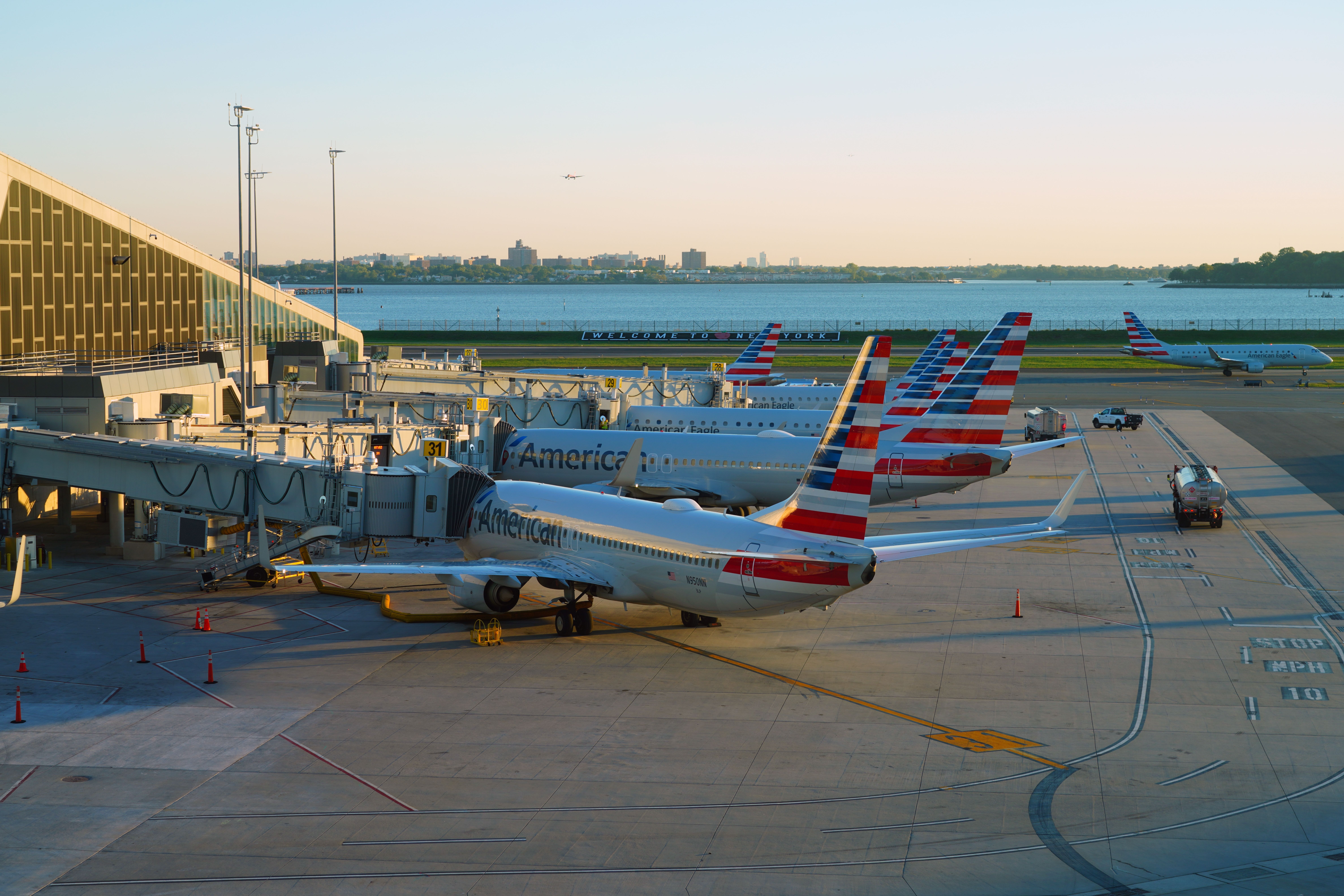 Multiple American Airlines aircraft parked at LaGuardia Airport.