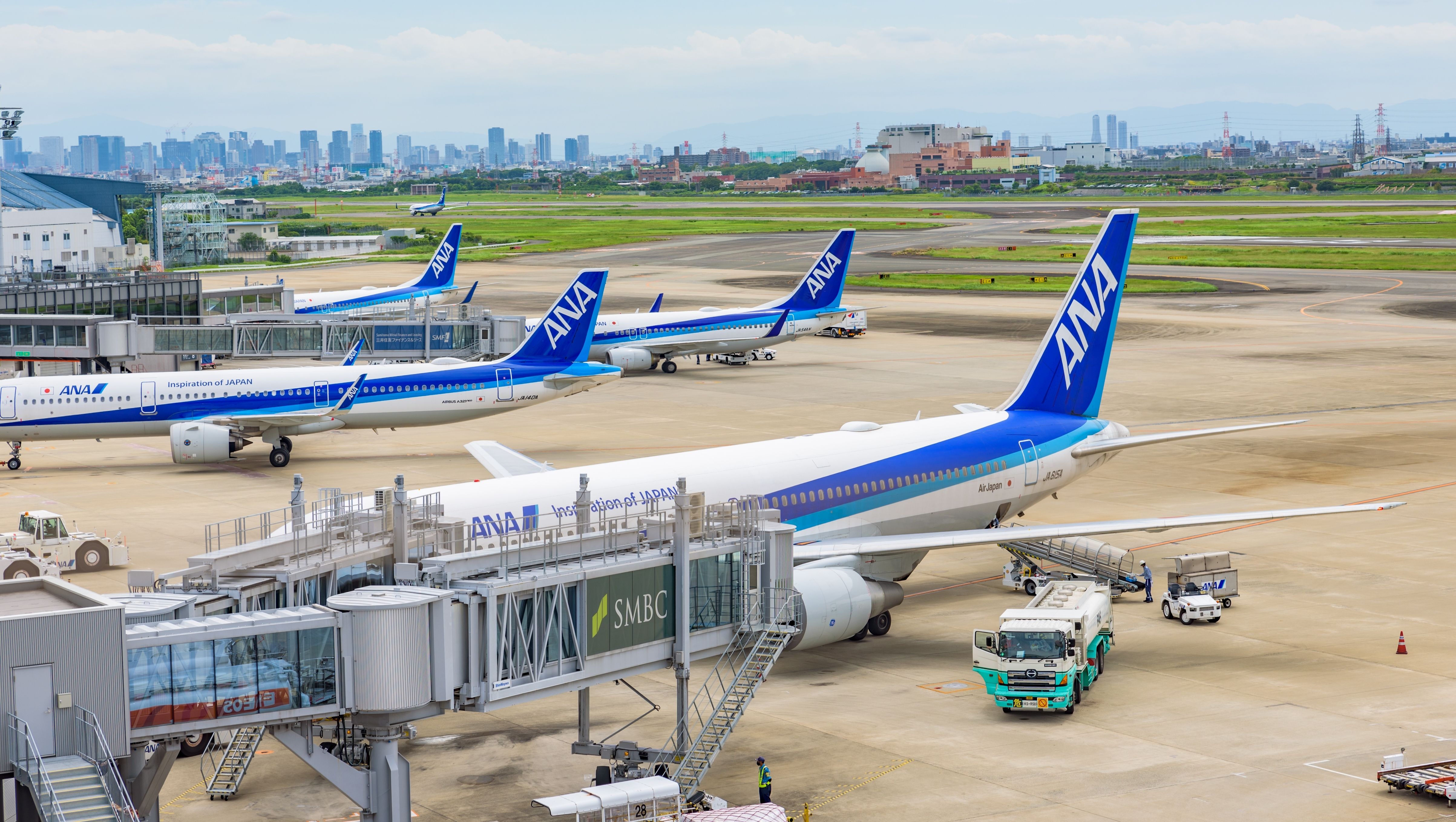Several ANA aircraft parked on the apron at Itami Airport in Osaka.