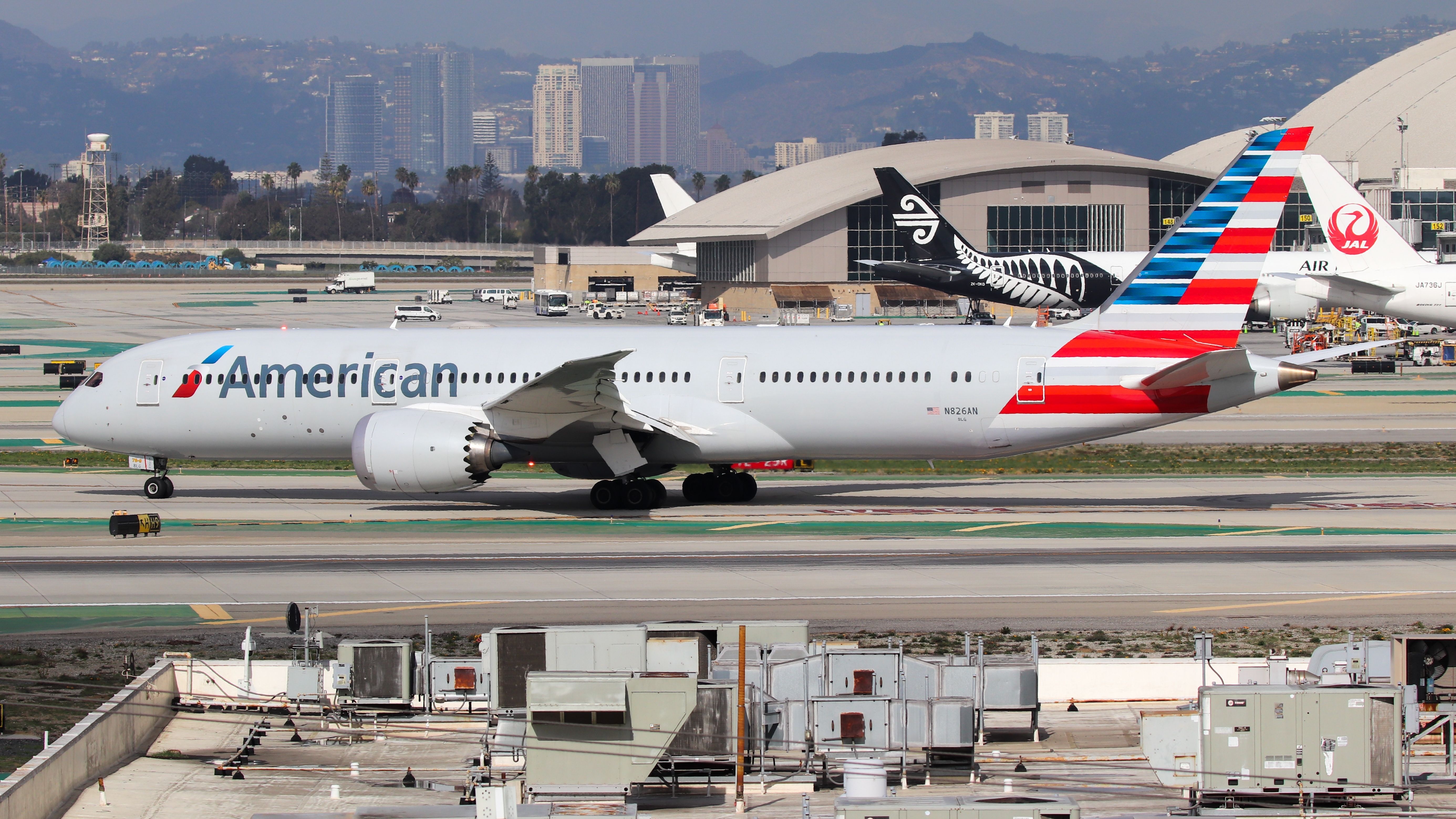 An American Airlines Boeing 787 taxiing to the gate.