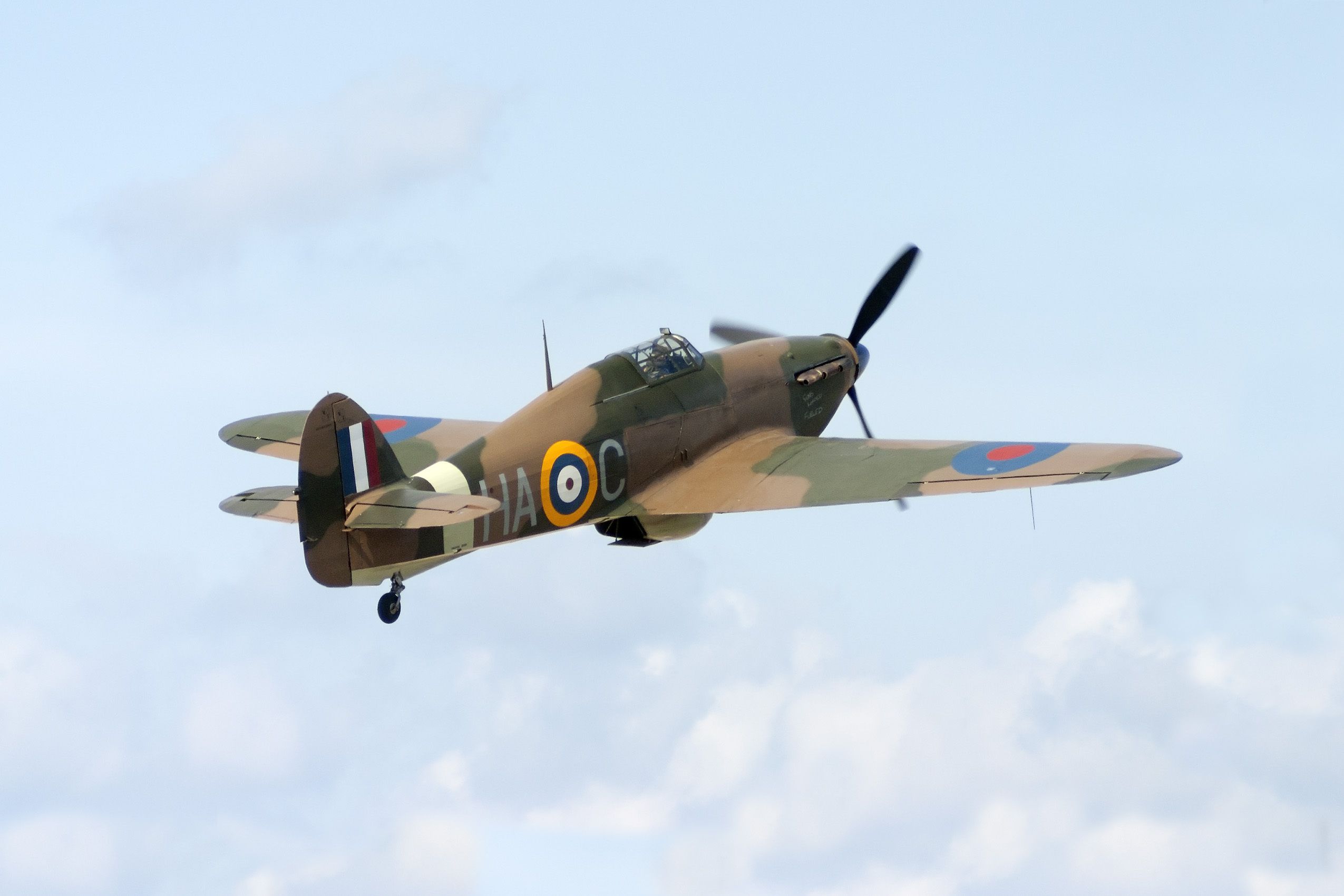 A Hawker Hurricane taking off into the sky.