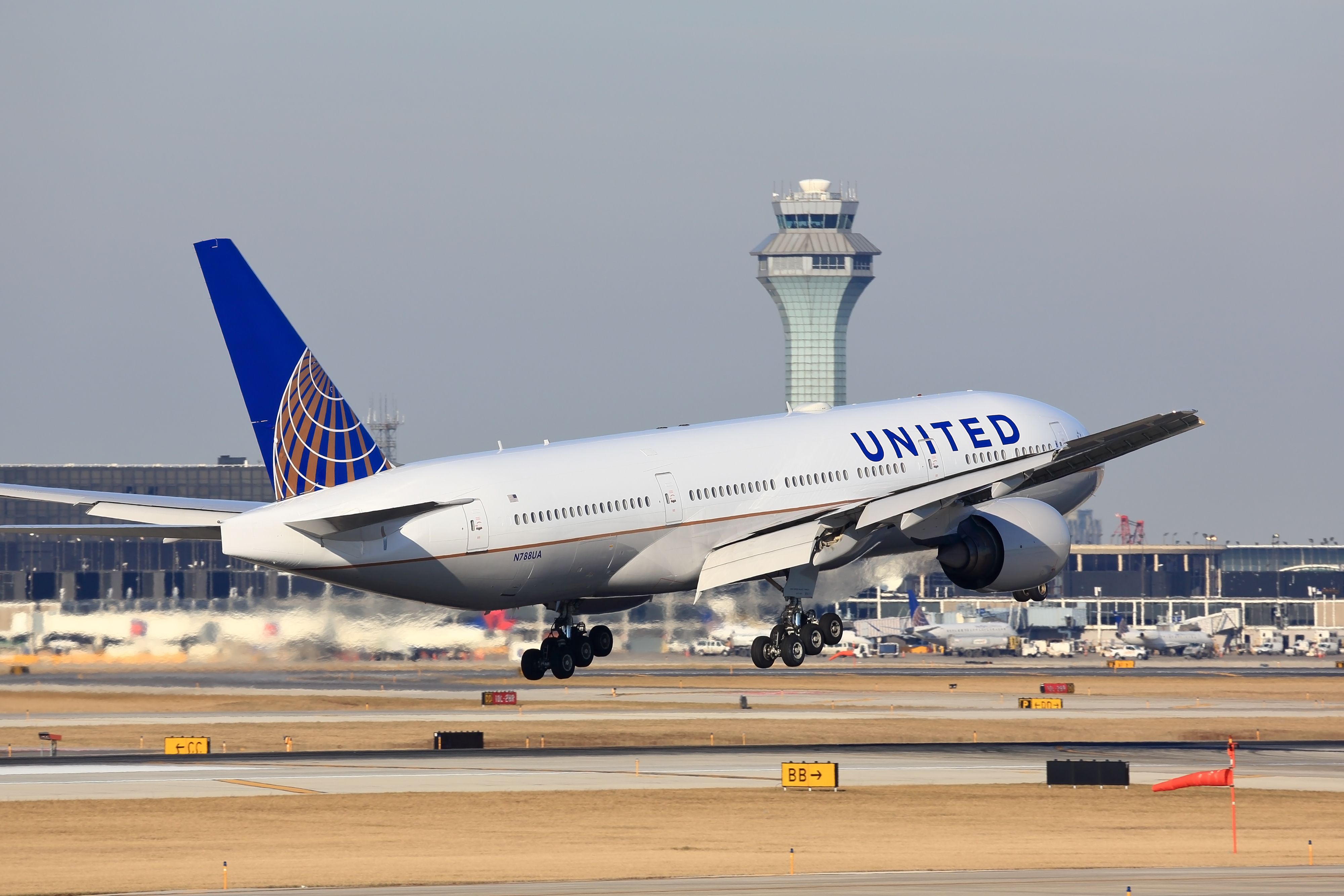 A United Airlines Boeing 777 taking off at ORD.