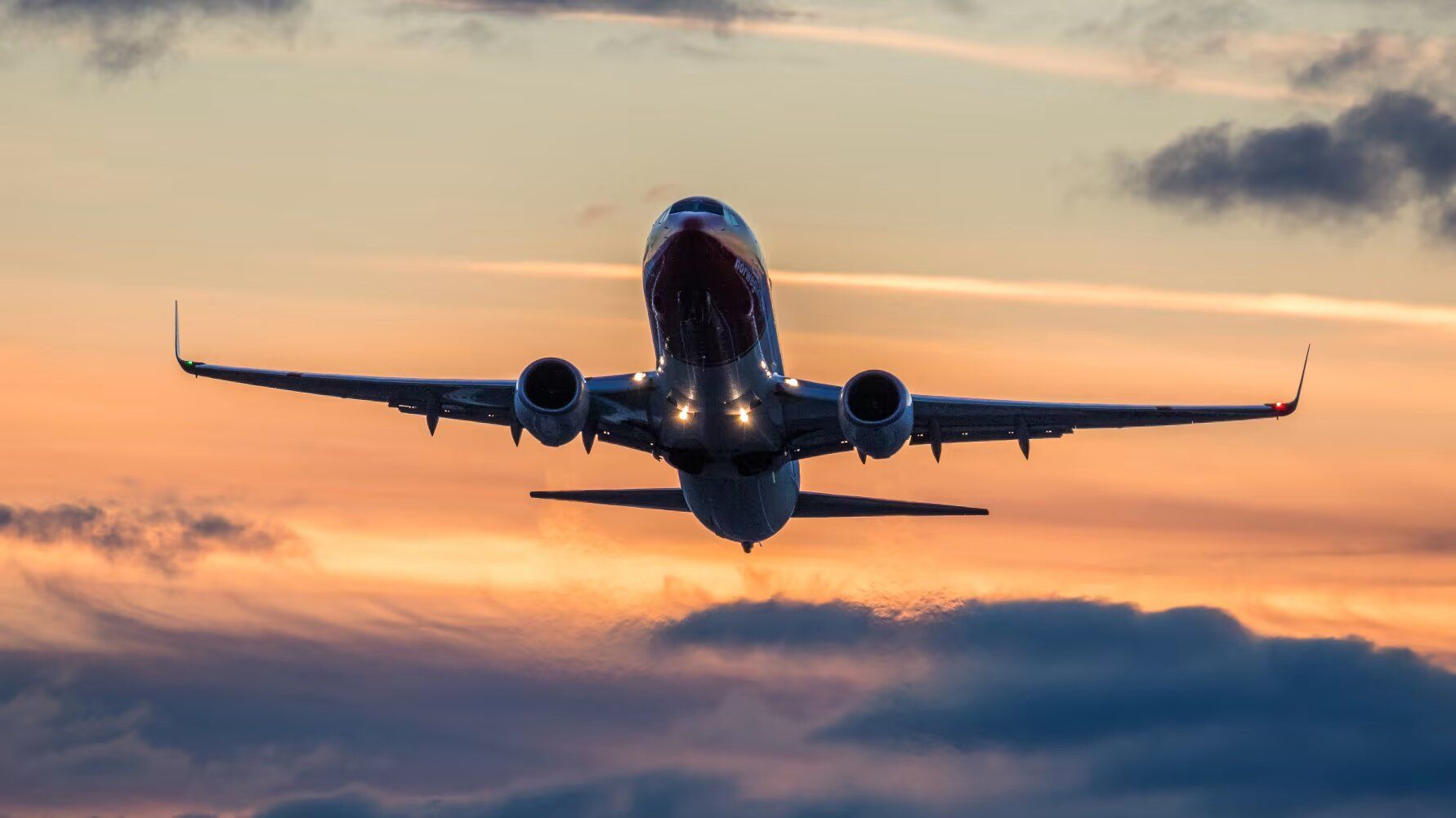 Norwegian Airlines Boeing 737 at sunset