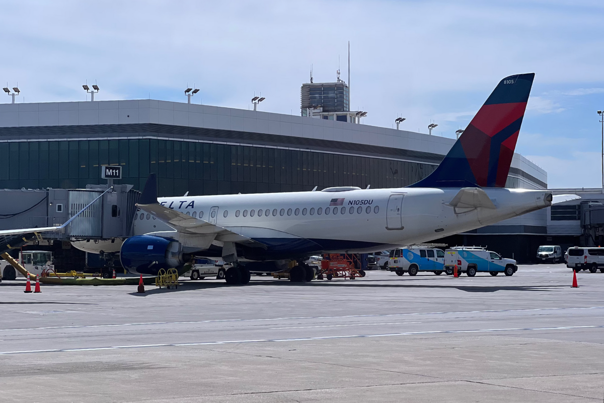 A delta air lines aircraft parked at the gate