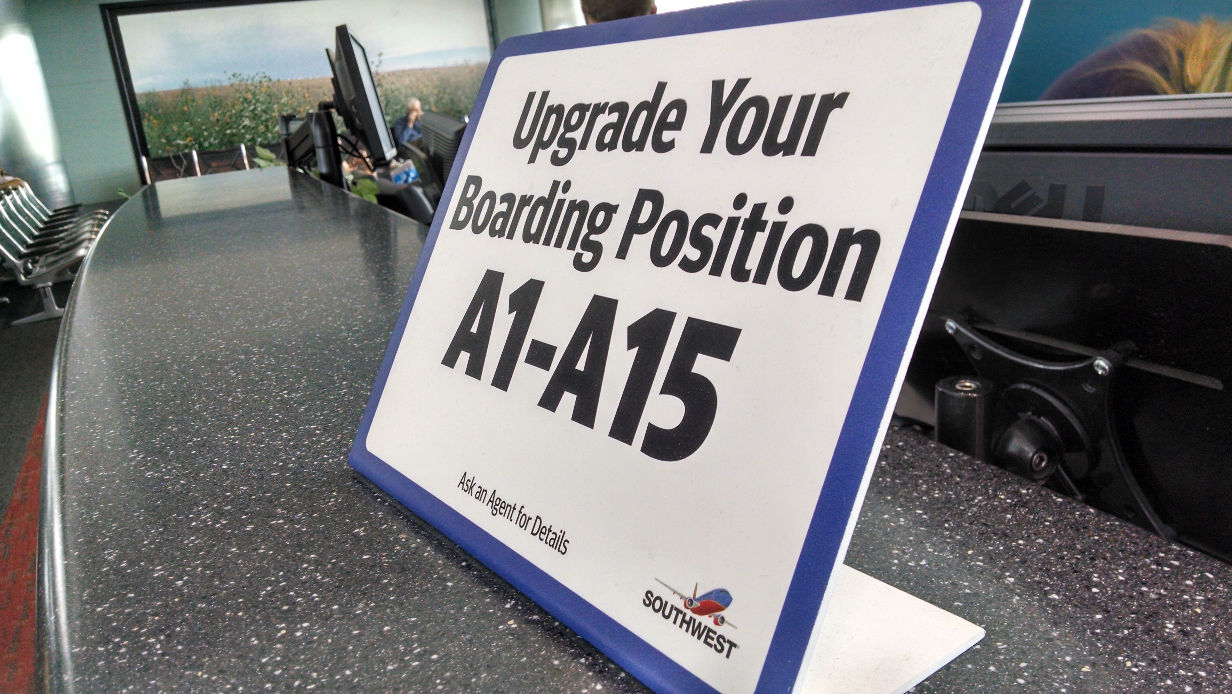 A Southwest Airlines boarding upgrade sign.