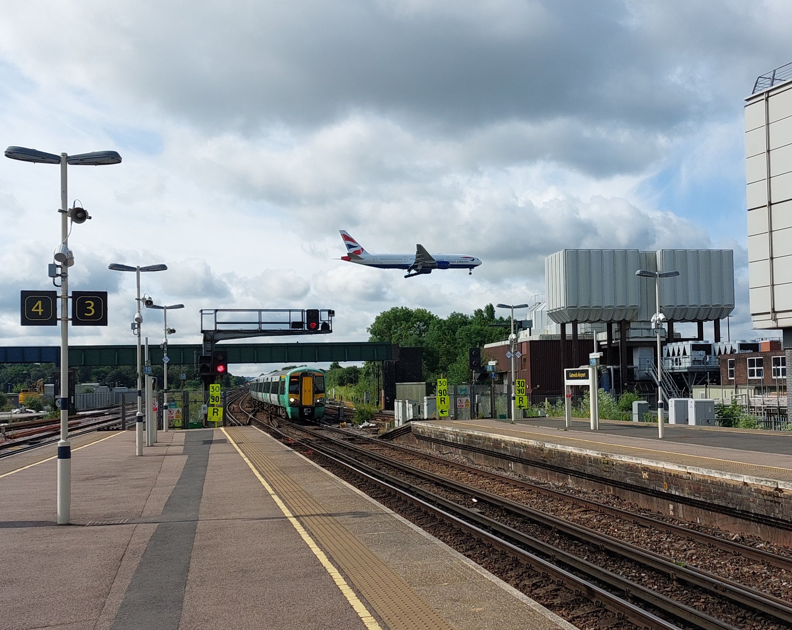 View from the Gatwick Airport Railway station as a British Airways aircraft is about to land.