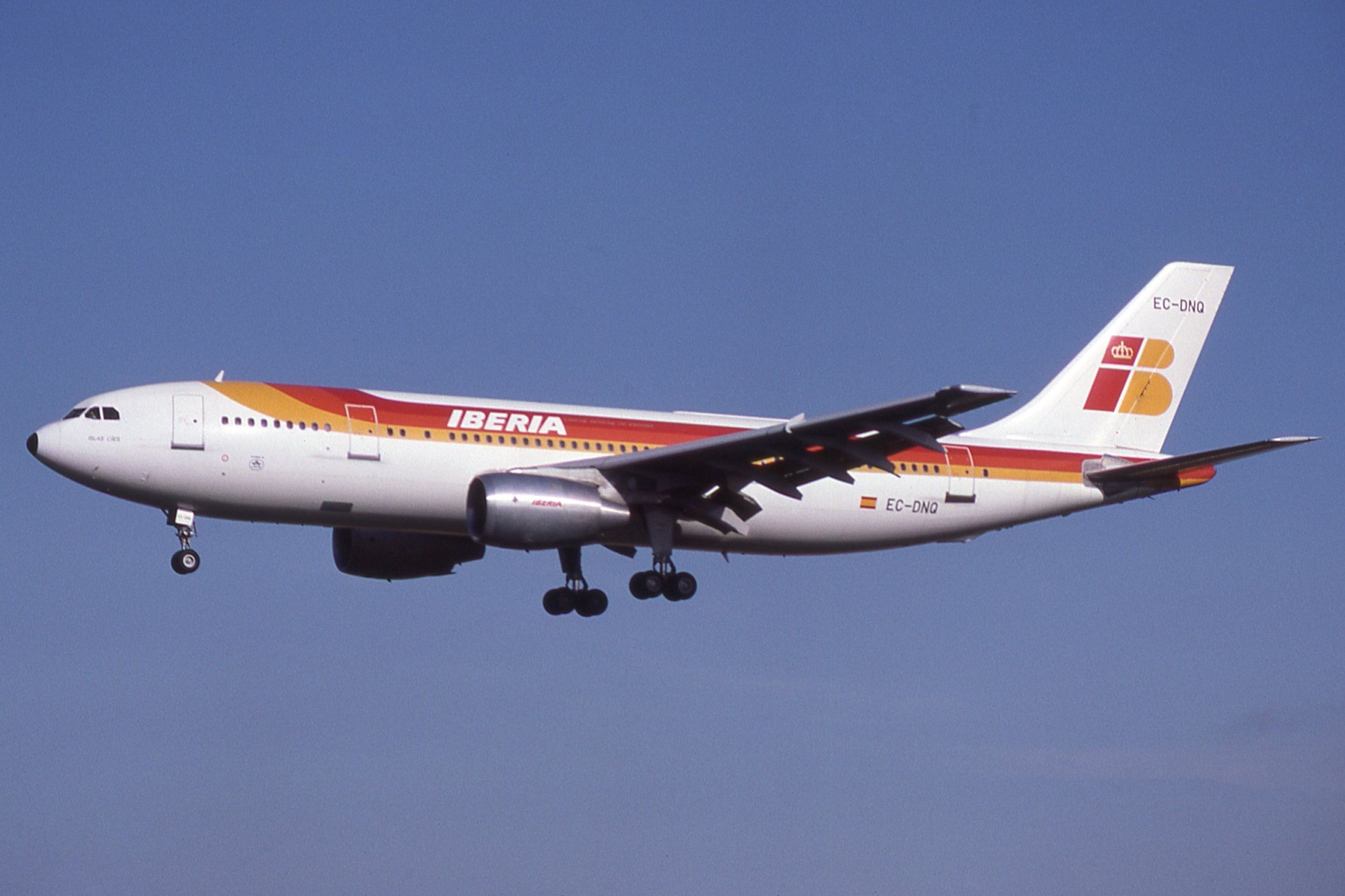 An Iberia Airbus A300 flying in the sky.