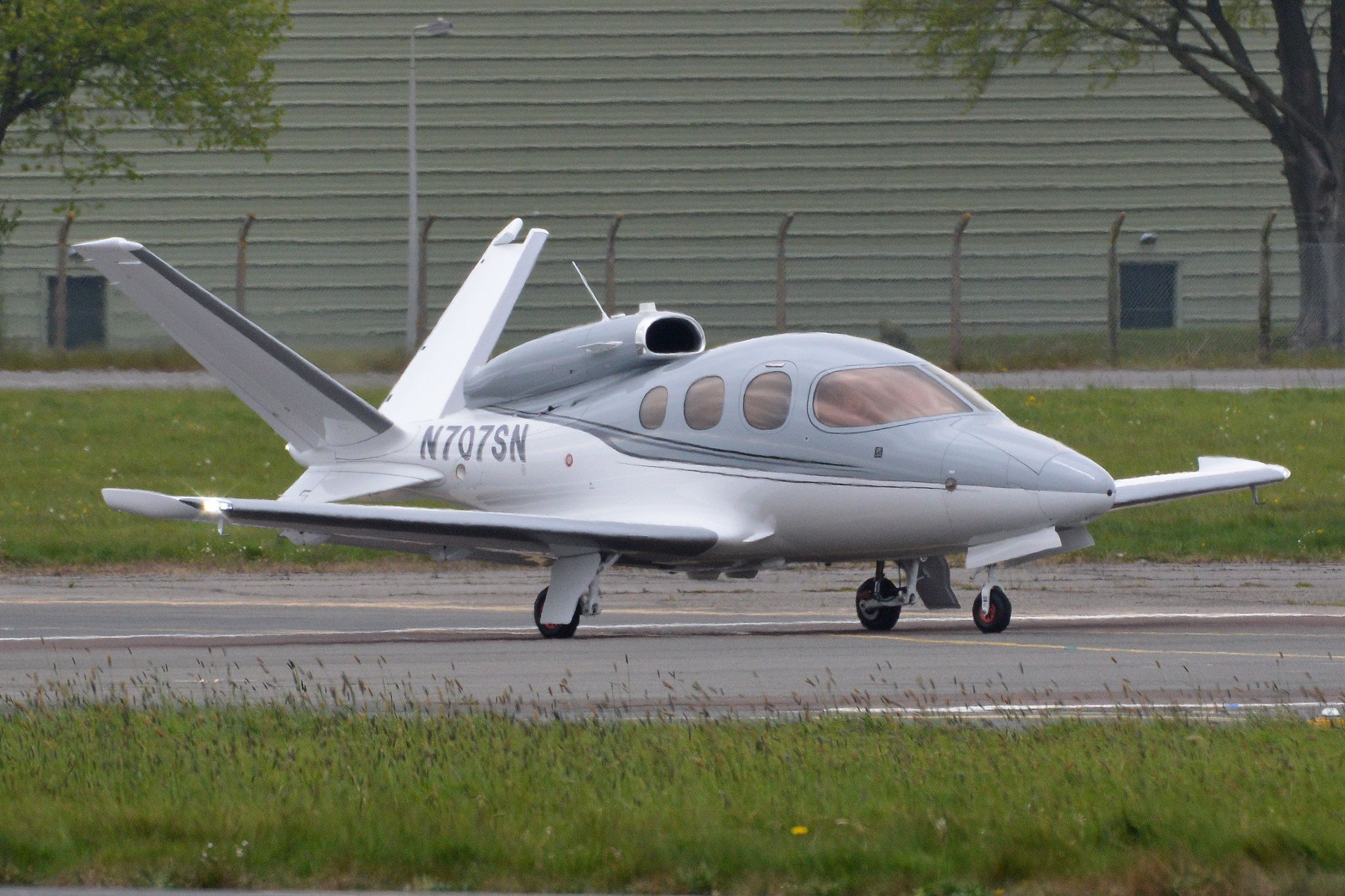 A Cirrus Vision Jet taxiing to the runway.