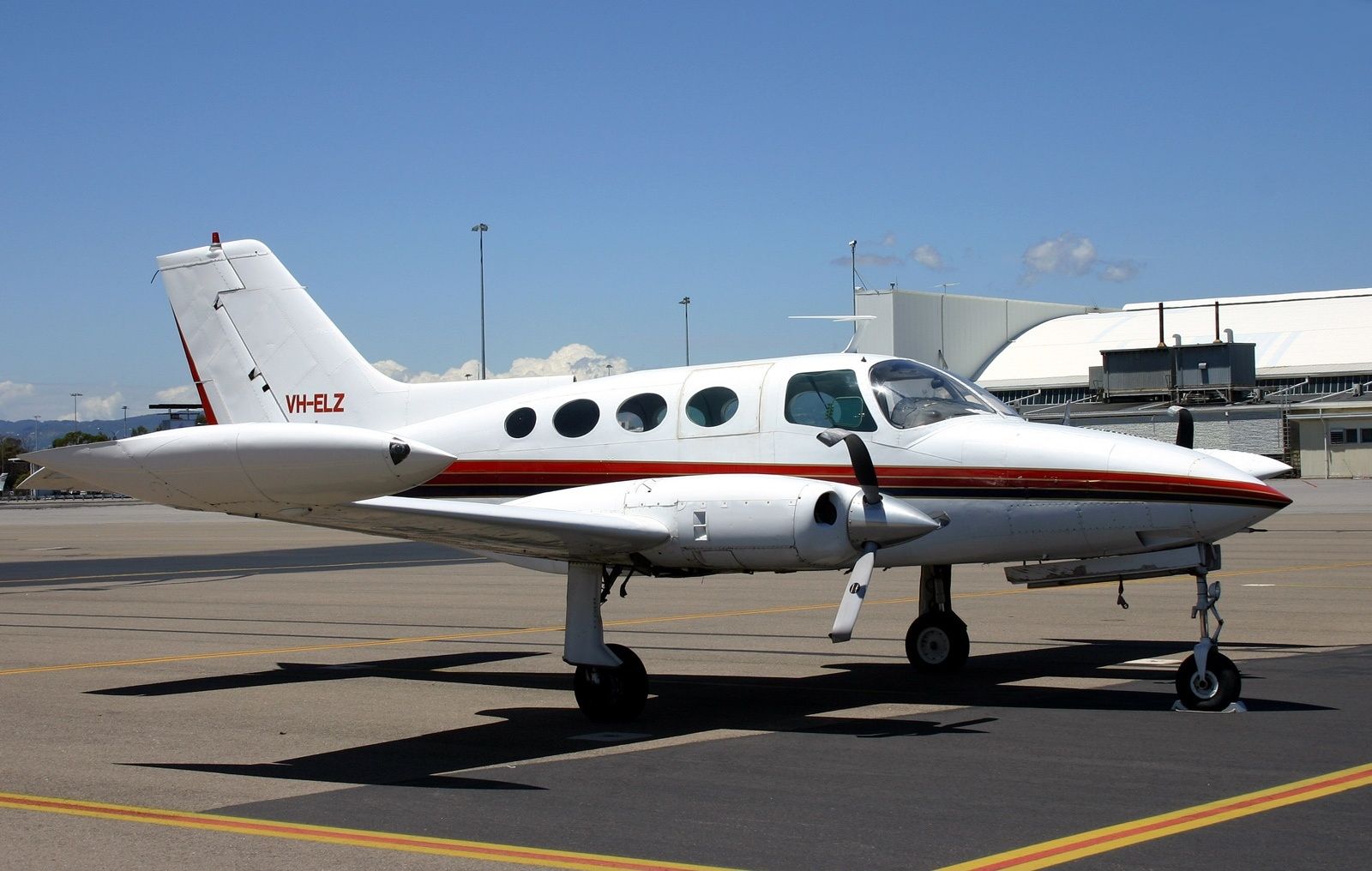 A Cessna 402 parked at an airport.