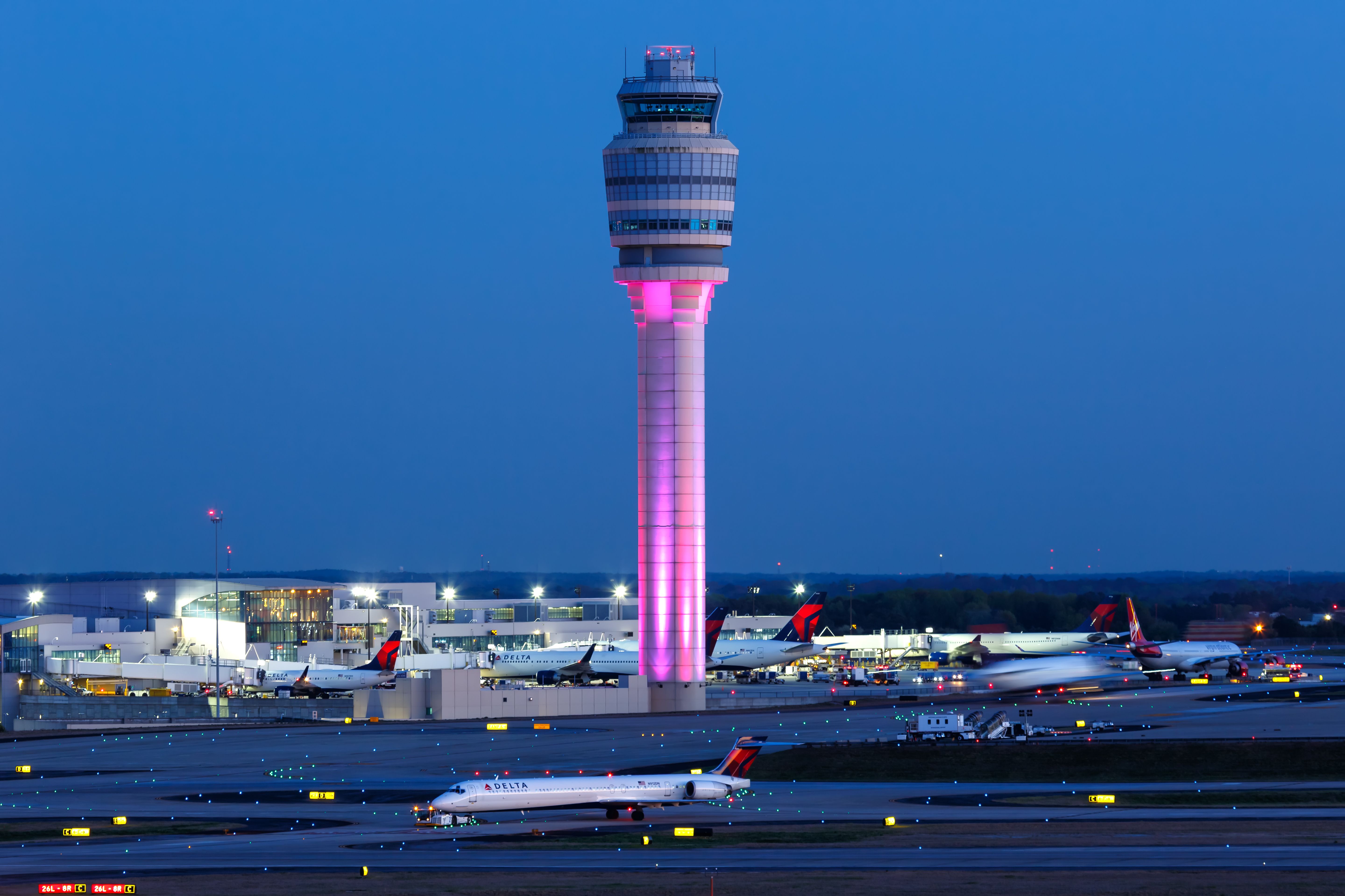 A view of the Atlanta Hartfield Jackson Airport apron at night.