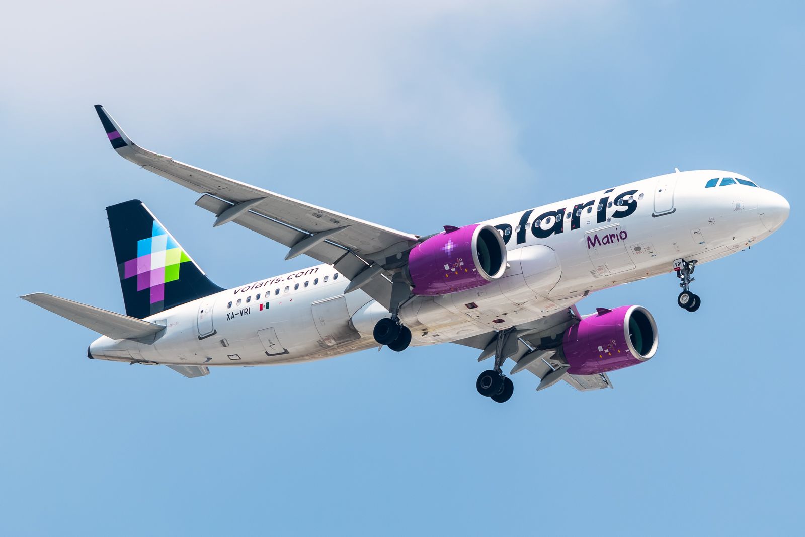 A Volaris Airbus A320neo flying near Mexico City International Airport.