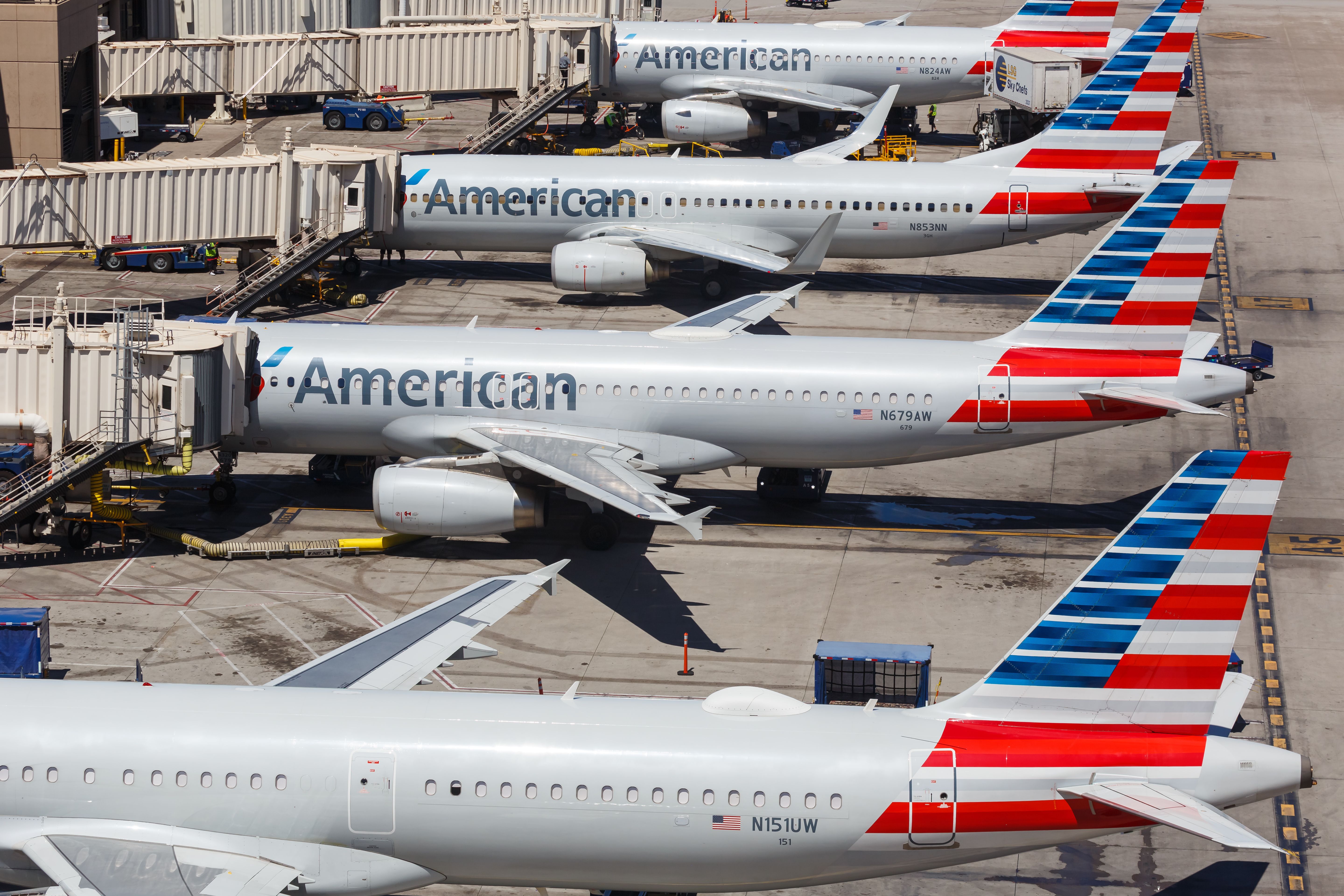 Many American Airlines aircraft parked at gates.